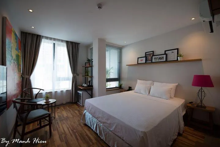 Bed in Mojzo Inn Boutique Hotel