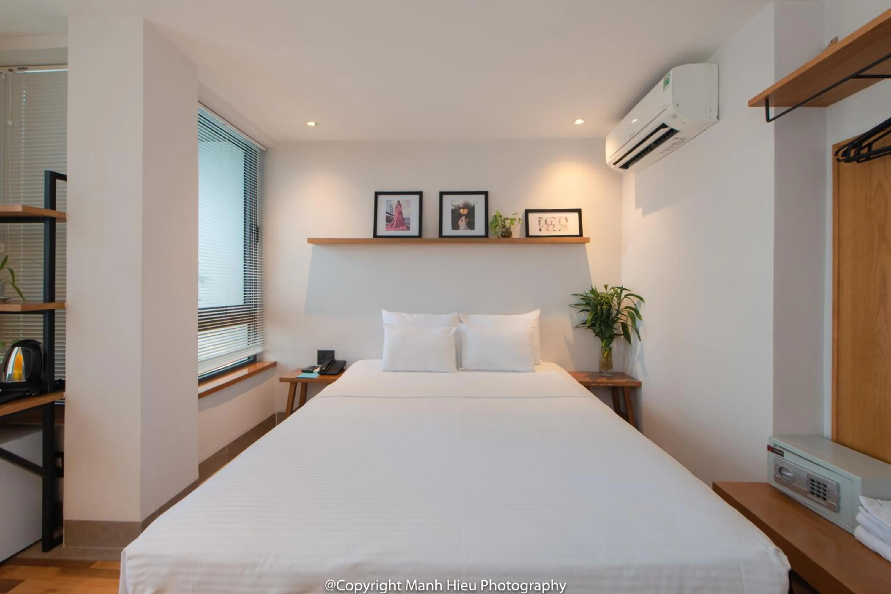 Bed in Mojzo Inn Boutique Hotel