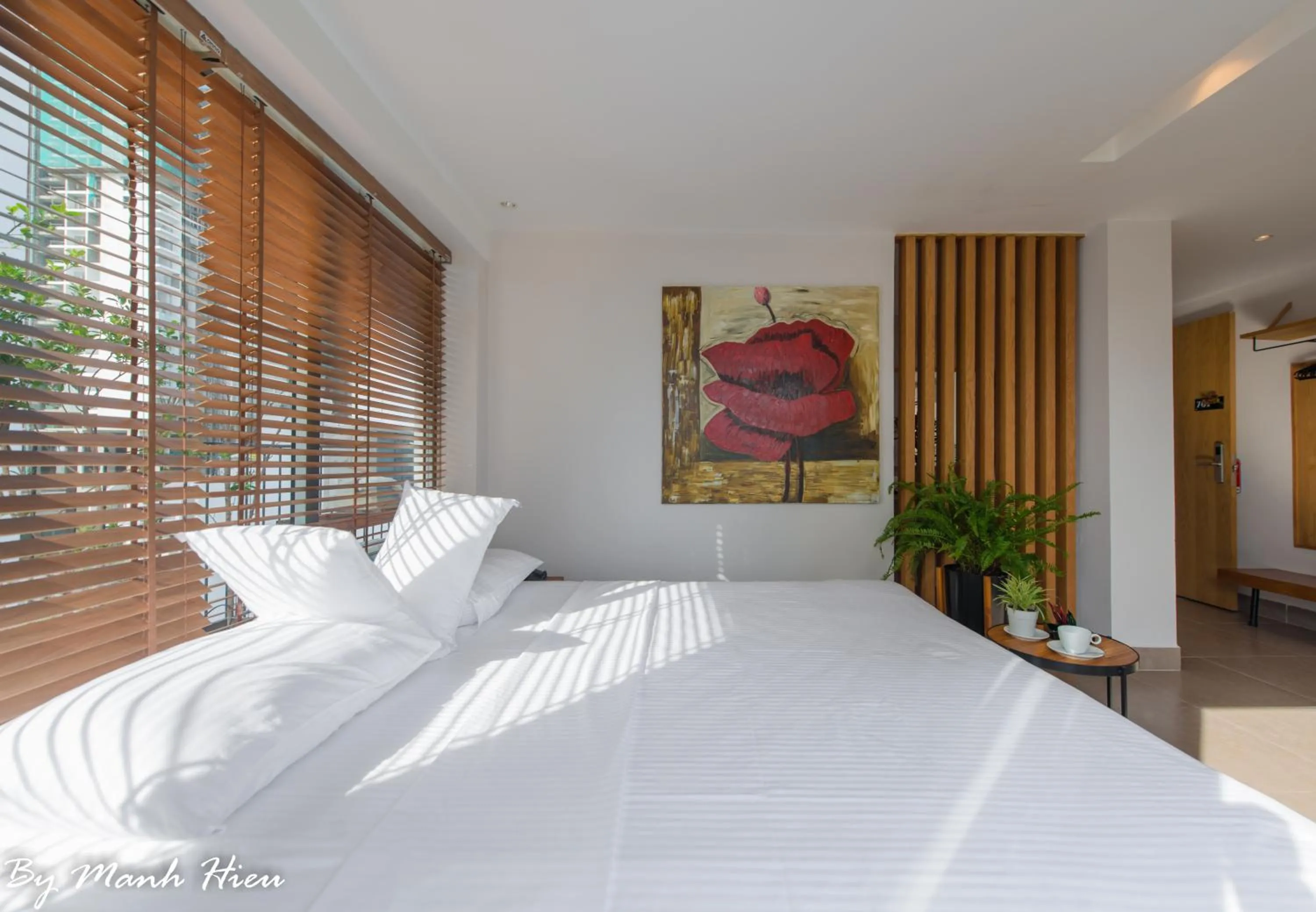 Bed in Mojzo Inn Boutique Hotel