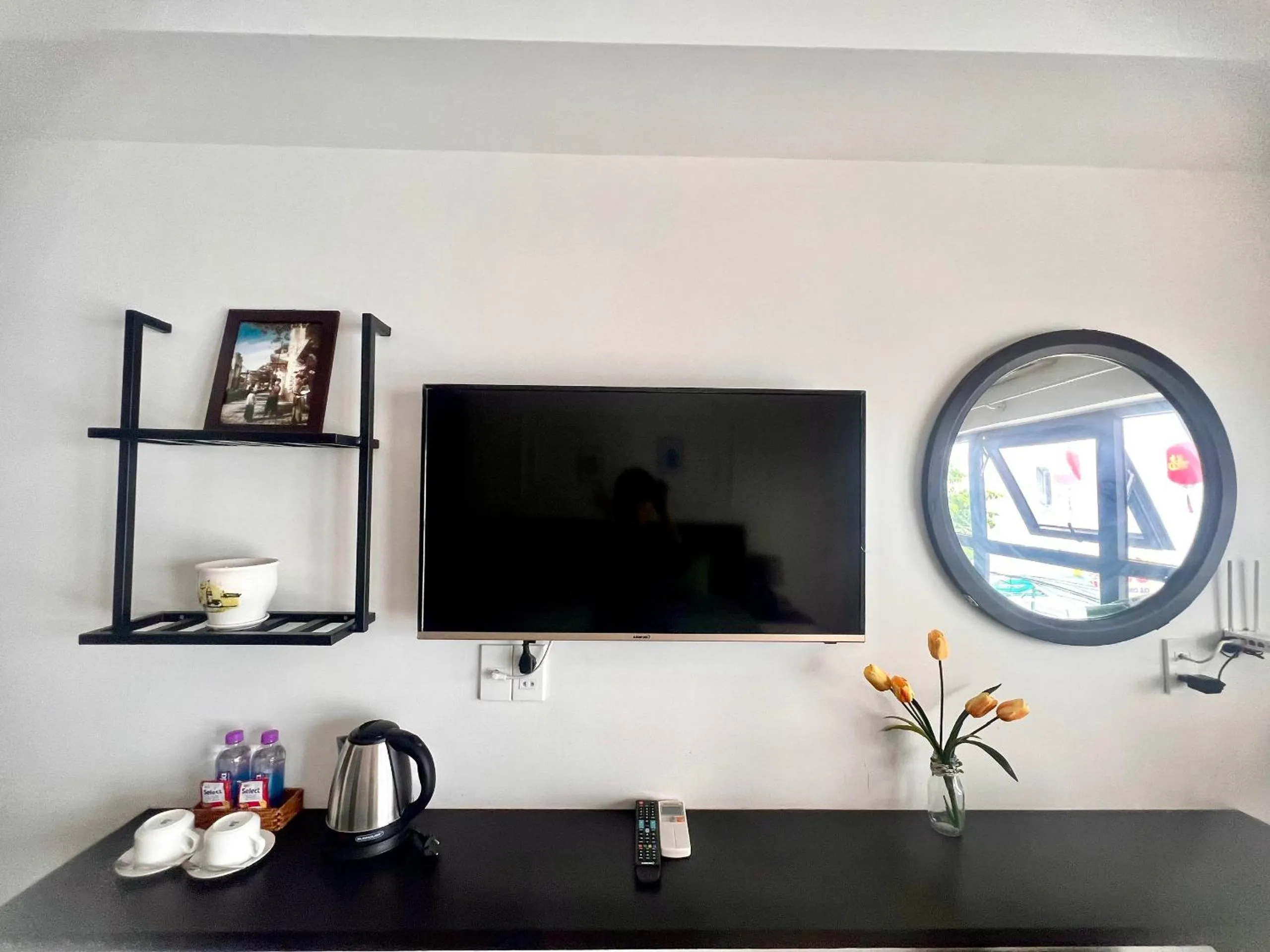 TV and multimedia, TV/Entertainment Center in Marina Boutique Hotel