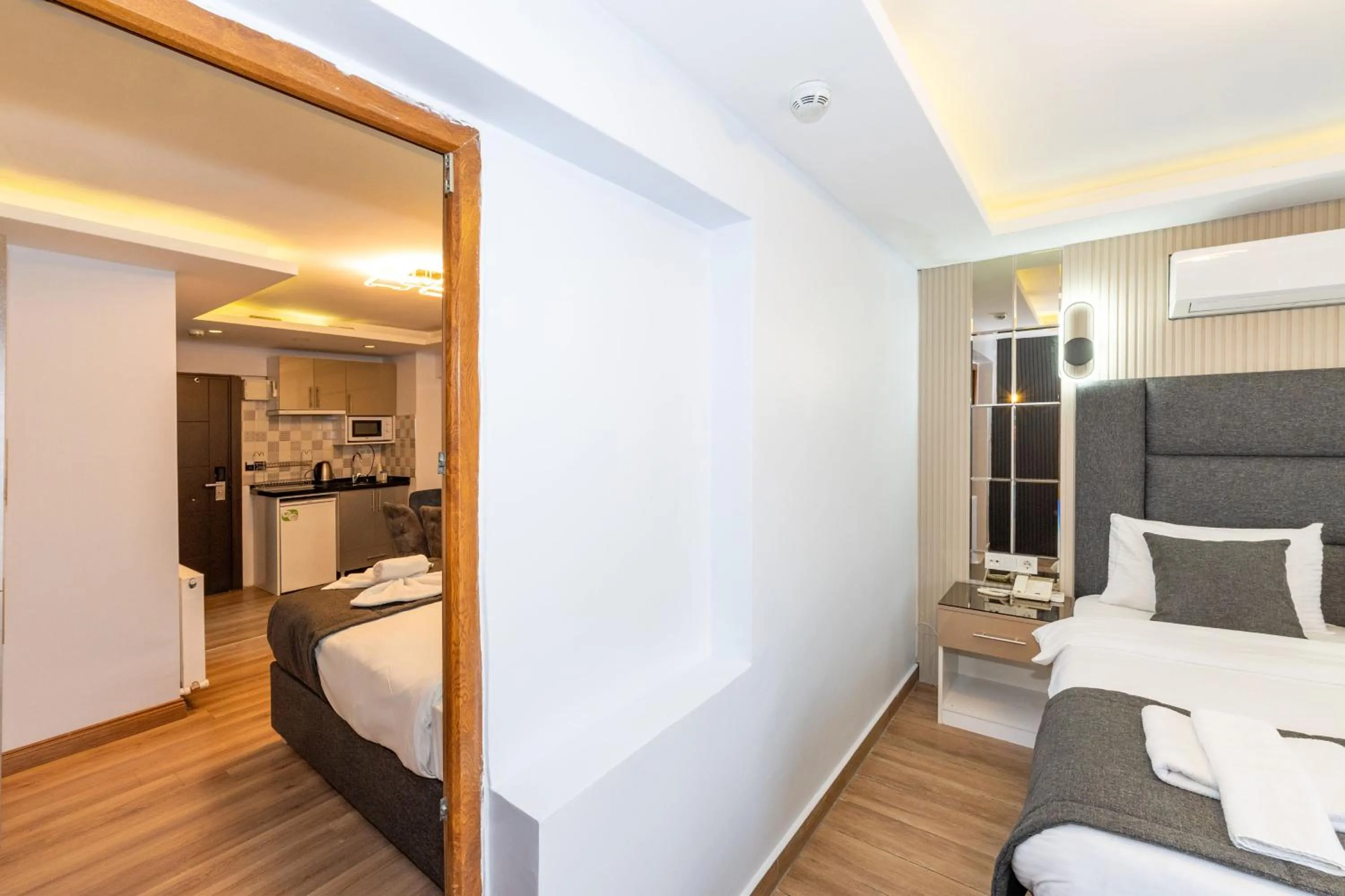 Living room, Bed in T-Square Residence