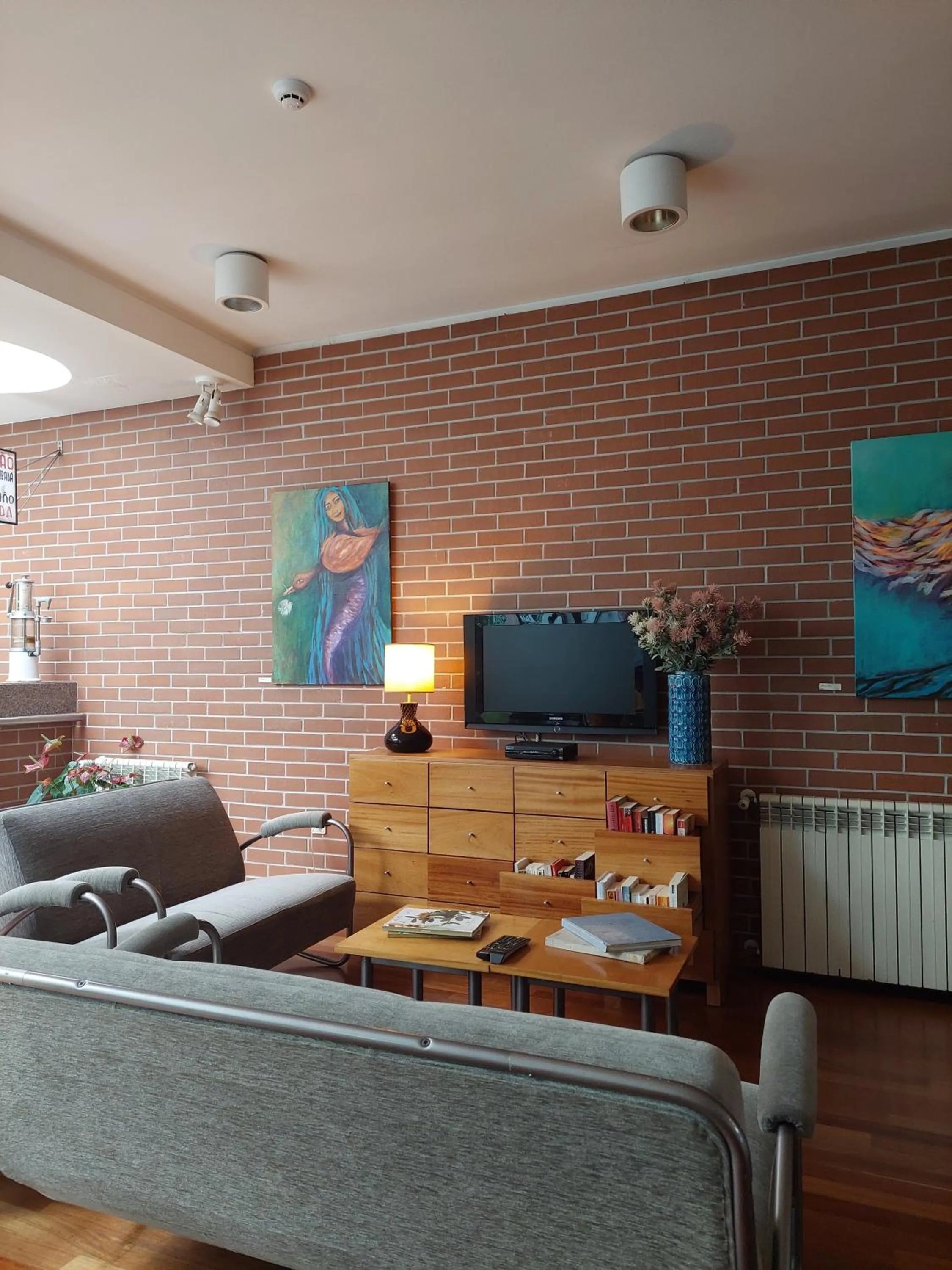 Communal lounge/ TV room in Costa Nova Hotel