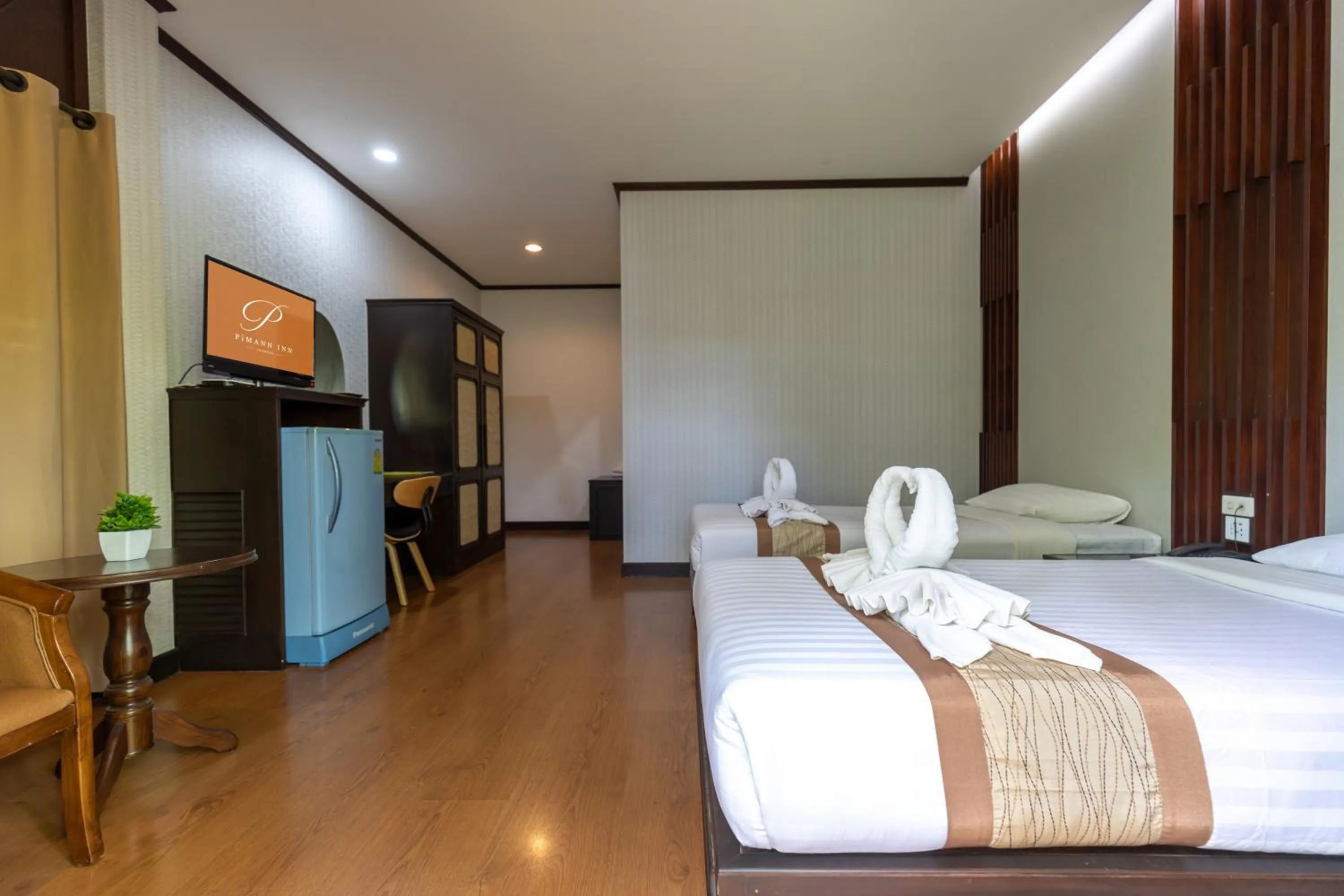 Bed in Pimann Inn Hotel