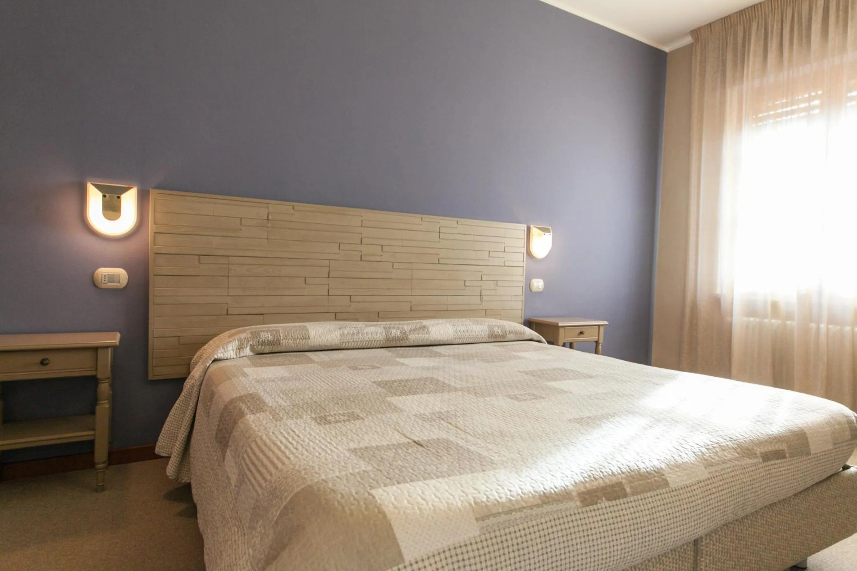 Bed in La Grotta Hotel