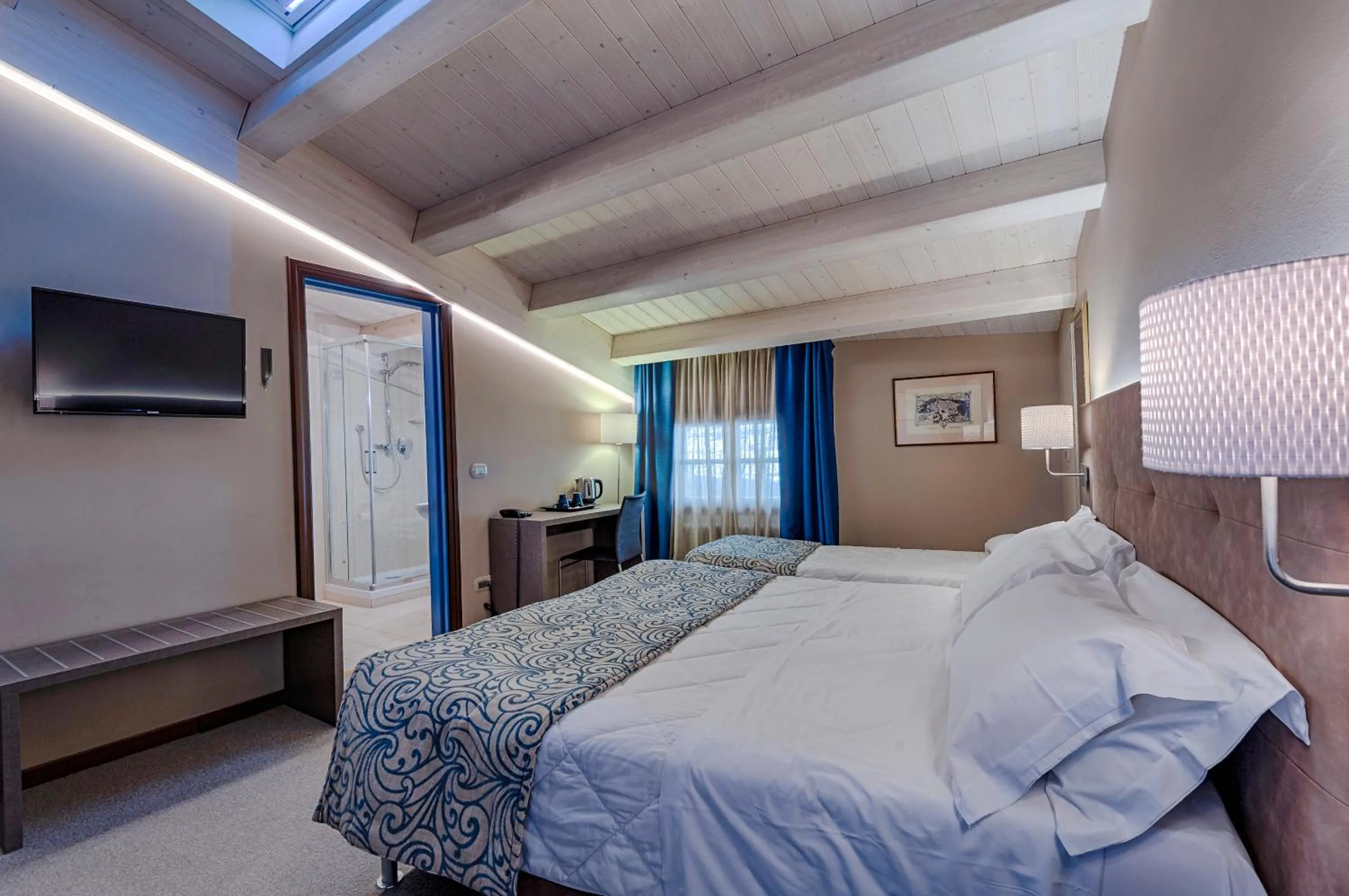 Bed in La Grotta Hotel