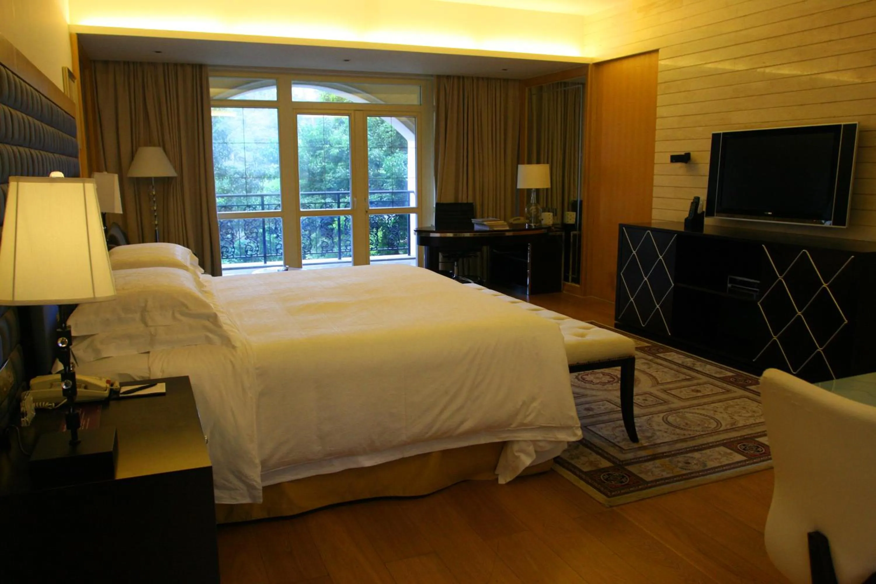 Bed in The Interlaken OCT Hotel