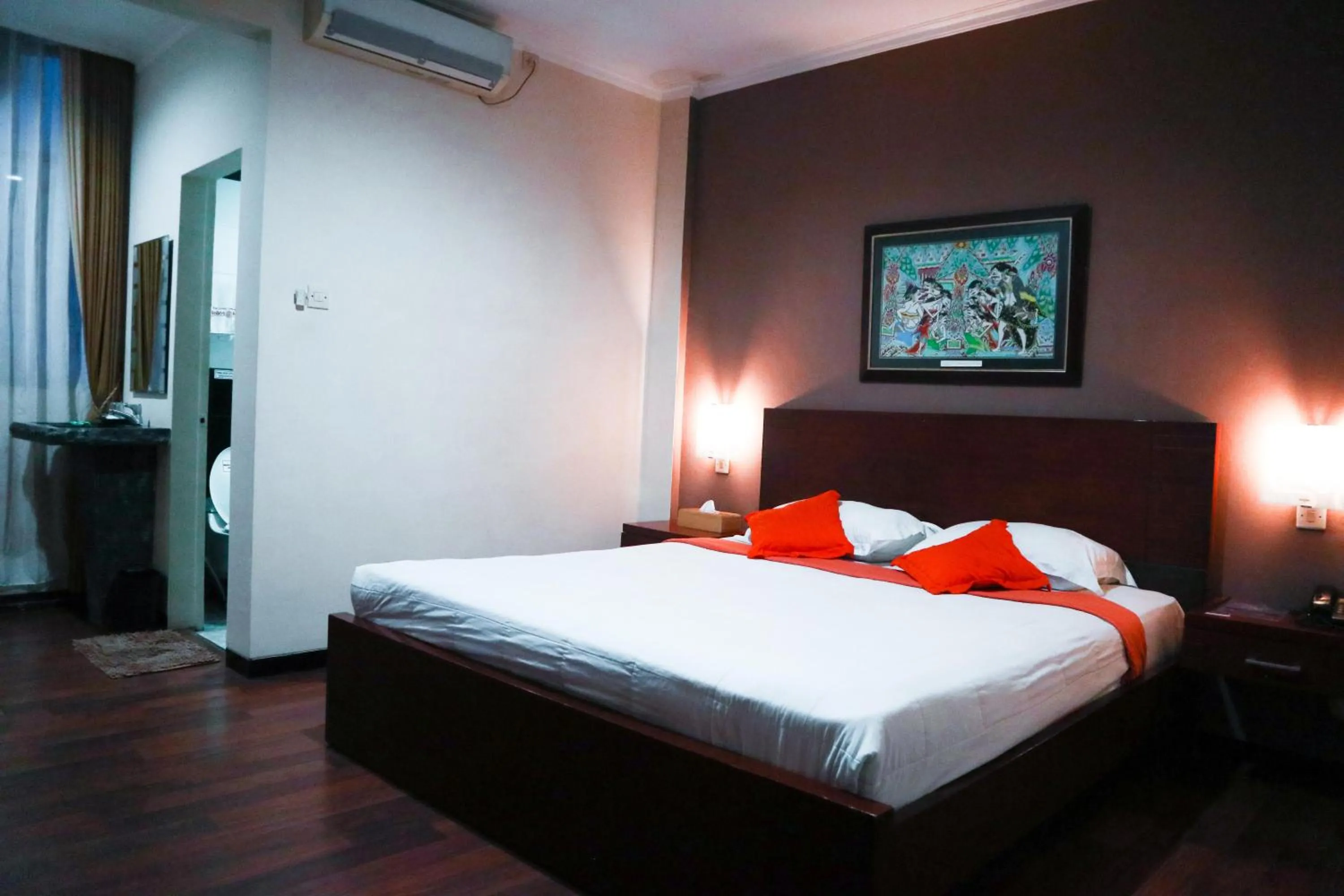 Bed in Helios Hotel Malang
