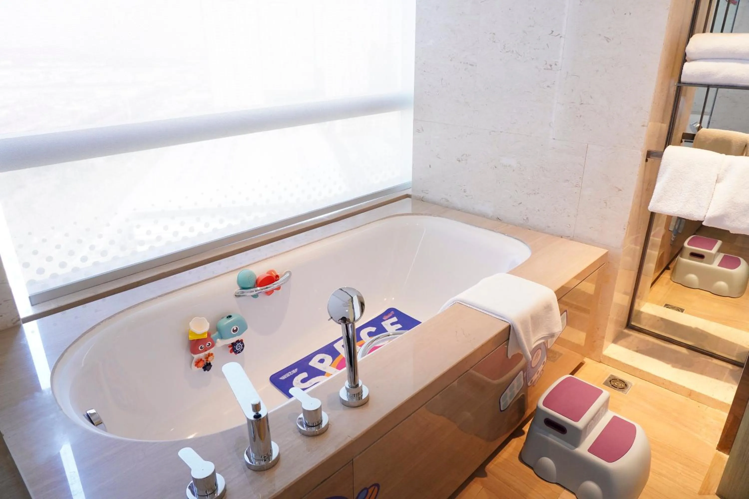 Bathroom in Crowne Plaza Dalian Sports Center by IHG