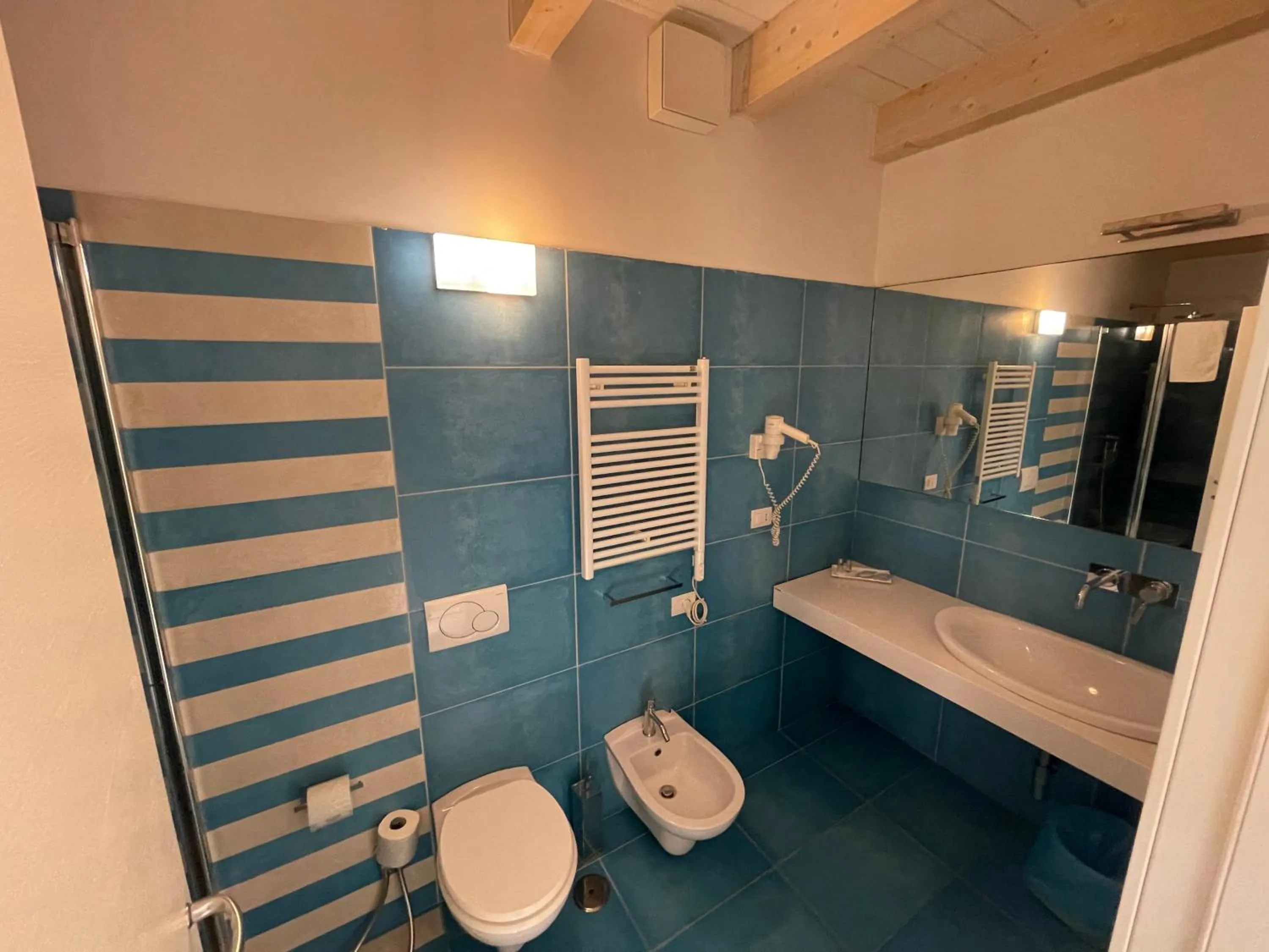 Bathroom in Baia Sangiorgio Hotel & Beach Club