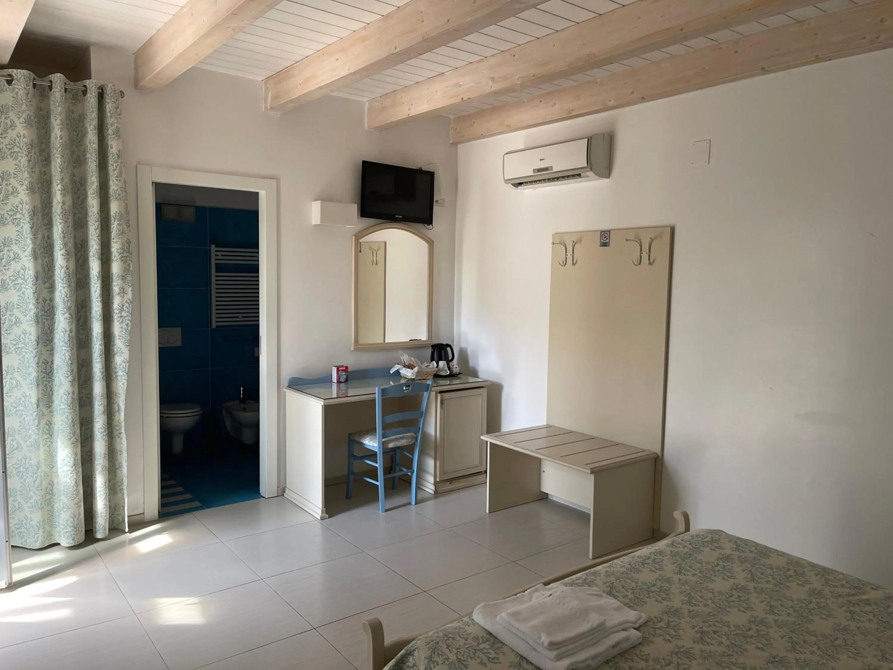 Photo of the whole room, Bed in Baia Sangiorgio Hotel & Beach Club