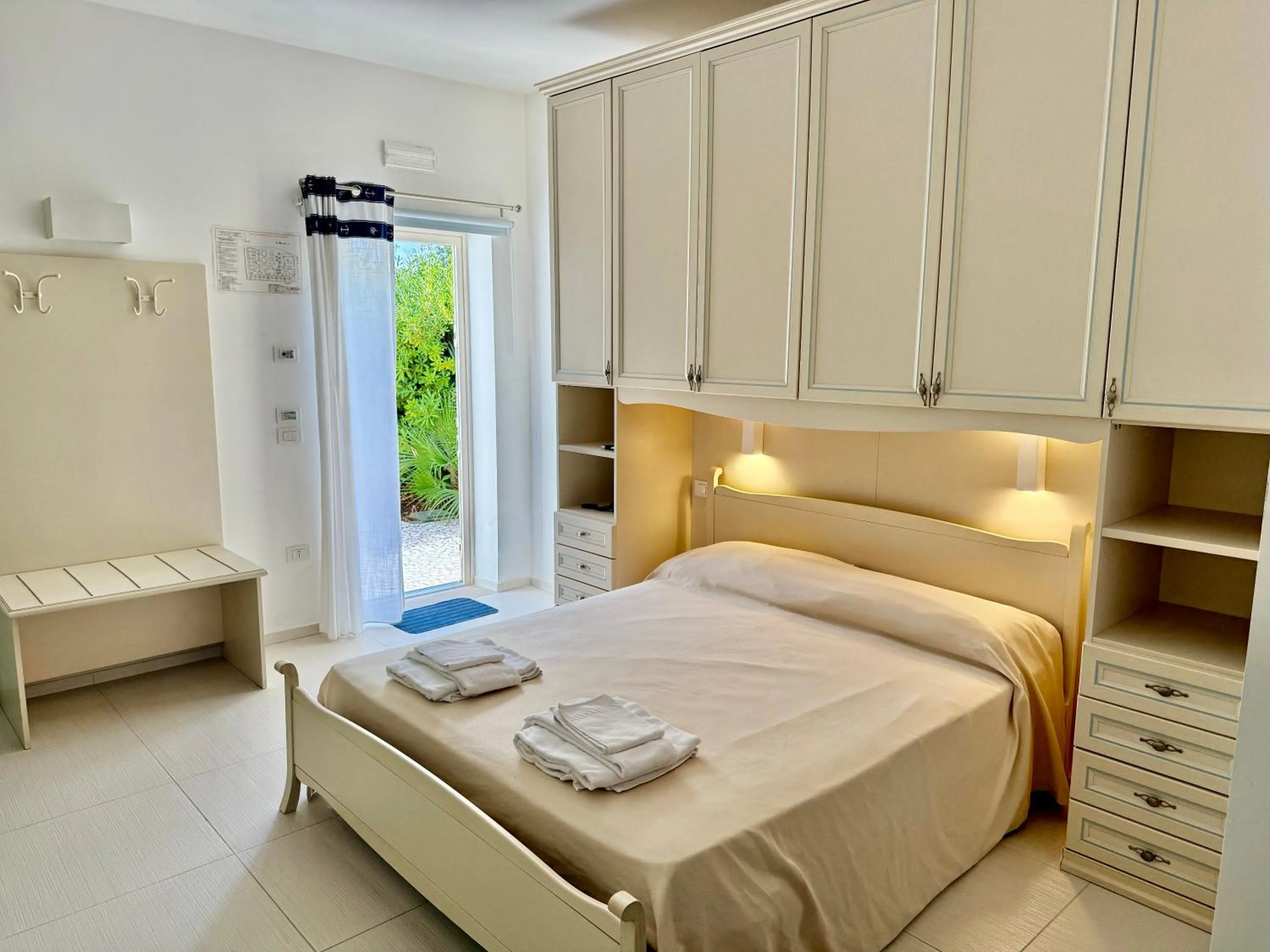 Bed in Baia Sangiorgio Hotel & Beach Club