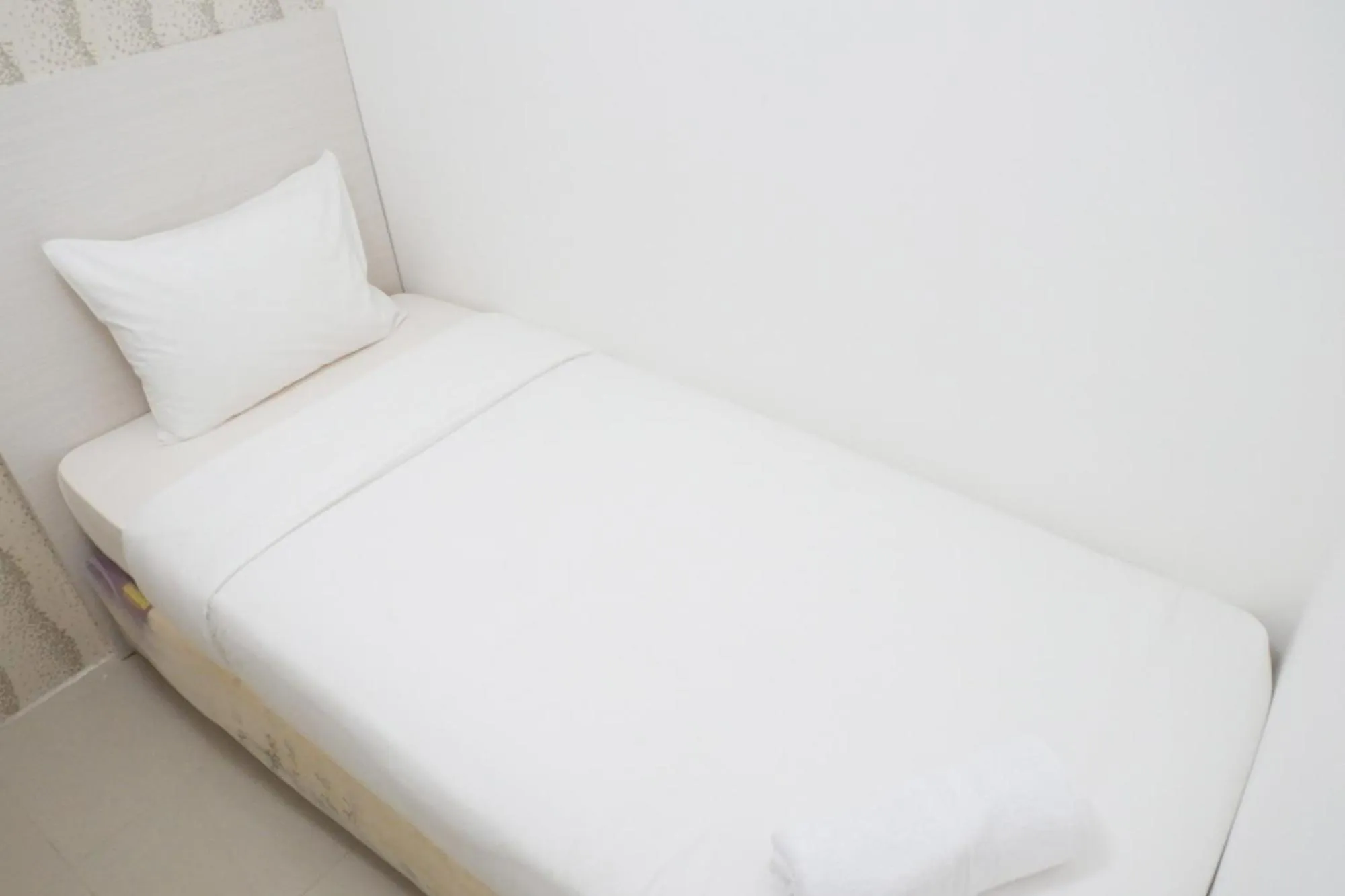 Bed in Exquisite 2BR Bassura City Apartment near Shopping Mall By Travelio