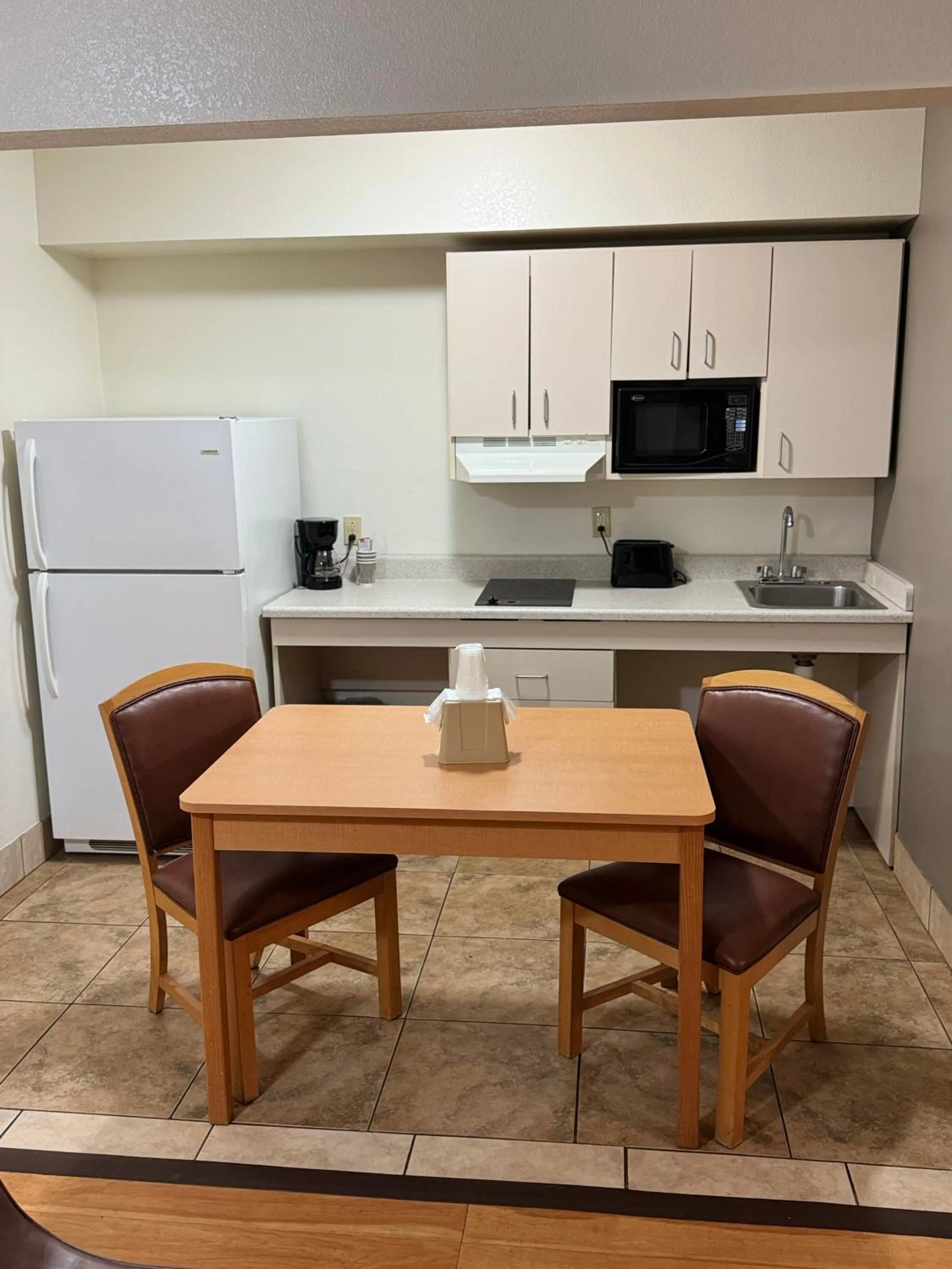 Kitchen or kitchenette in Blue Bonnet Suites -Lubbock, TX - Medical Center