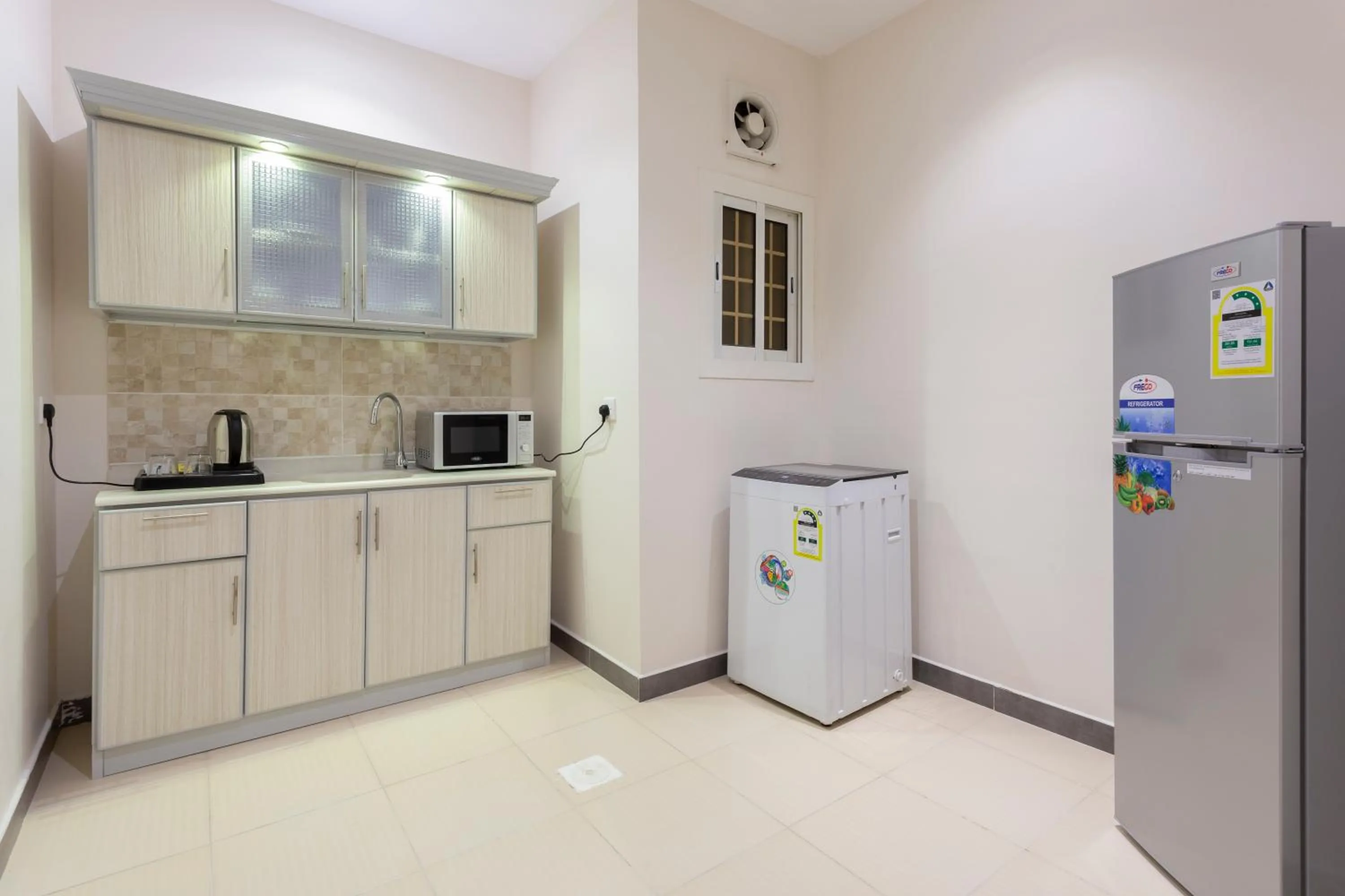 Kitchen or kitchenette in Dior Inn serviced apartments