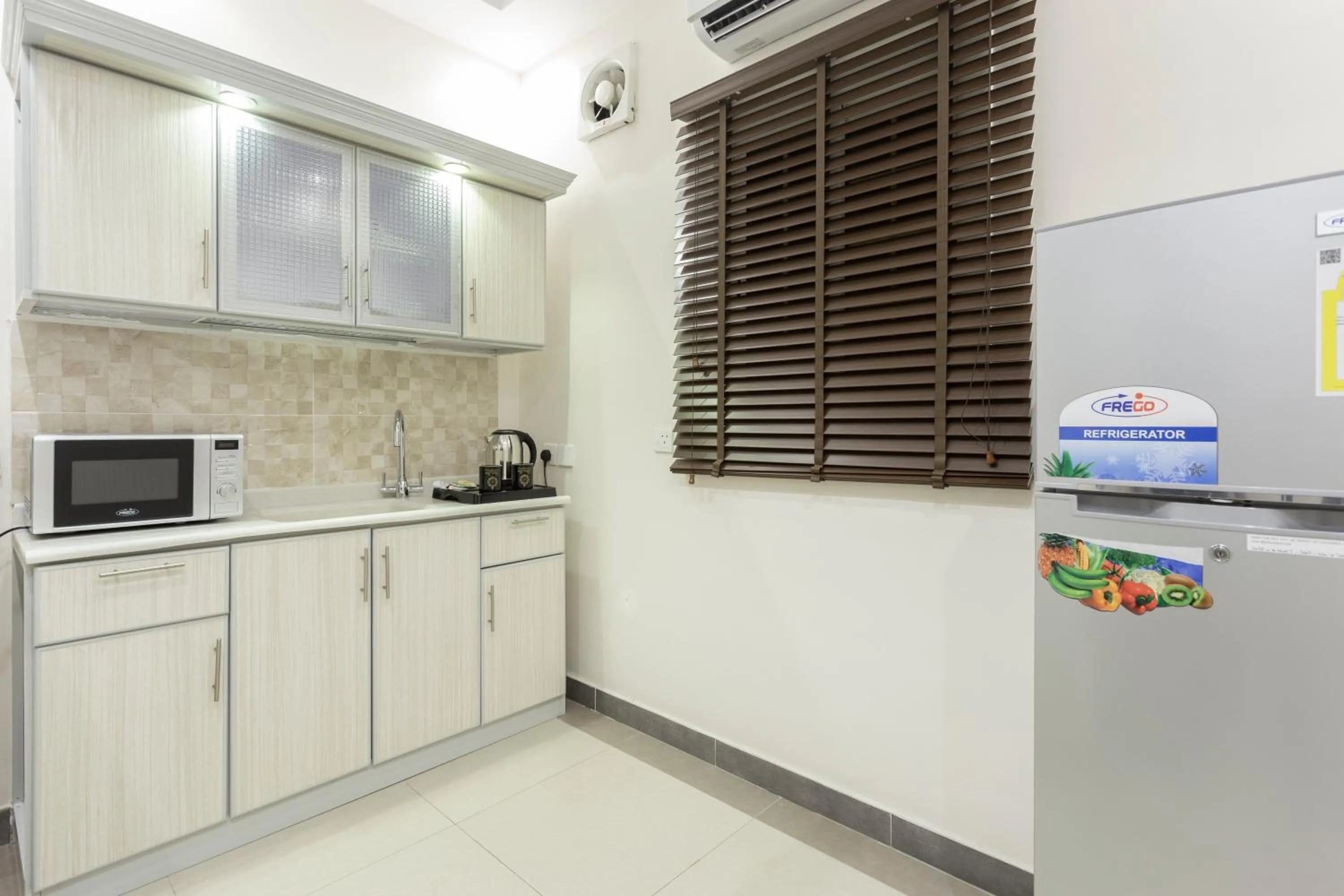 Kitchen or kitchenette in Dior Inn serviced apartments