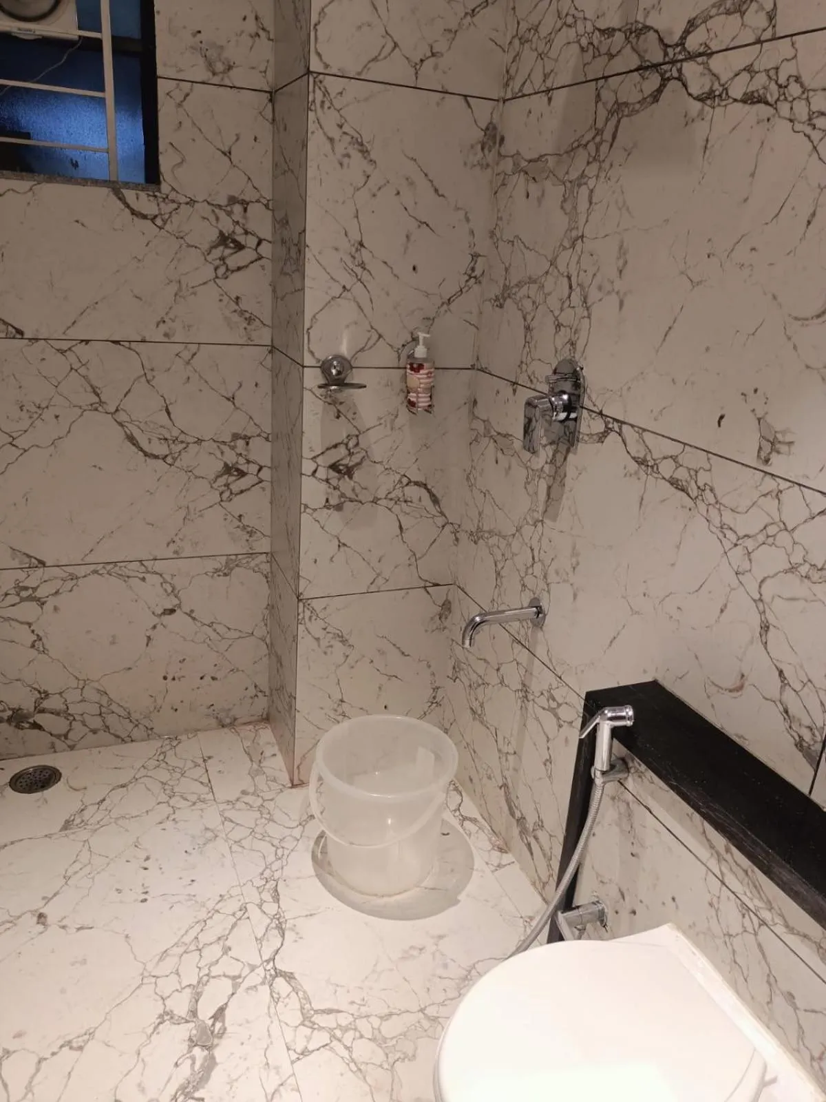 Bathroom in Treebo Elite Residency - 2 kms from Railway station