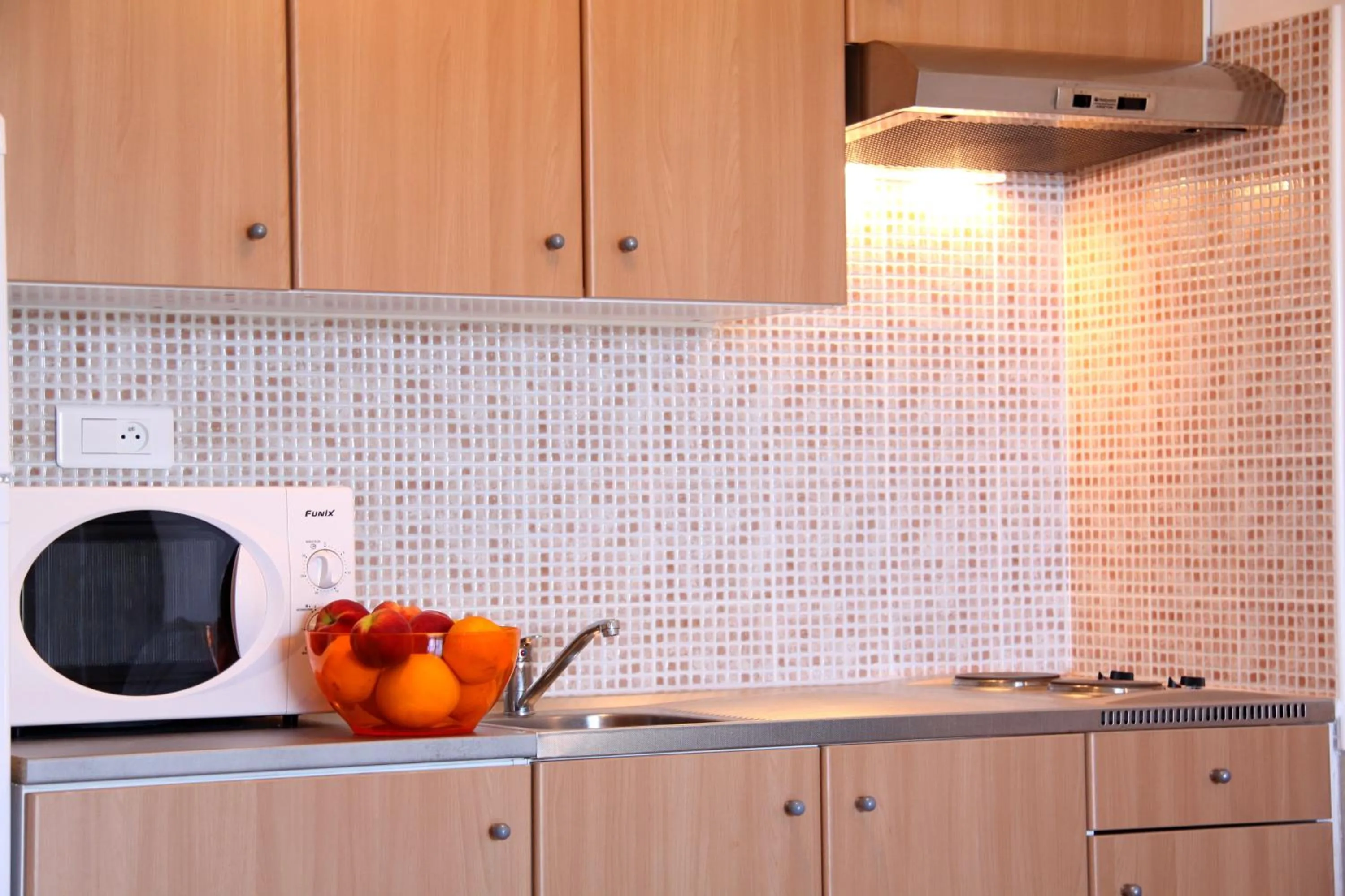 Kitchen or kitchenette in Hôtel et Résidence Benista