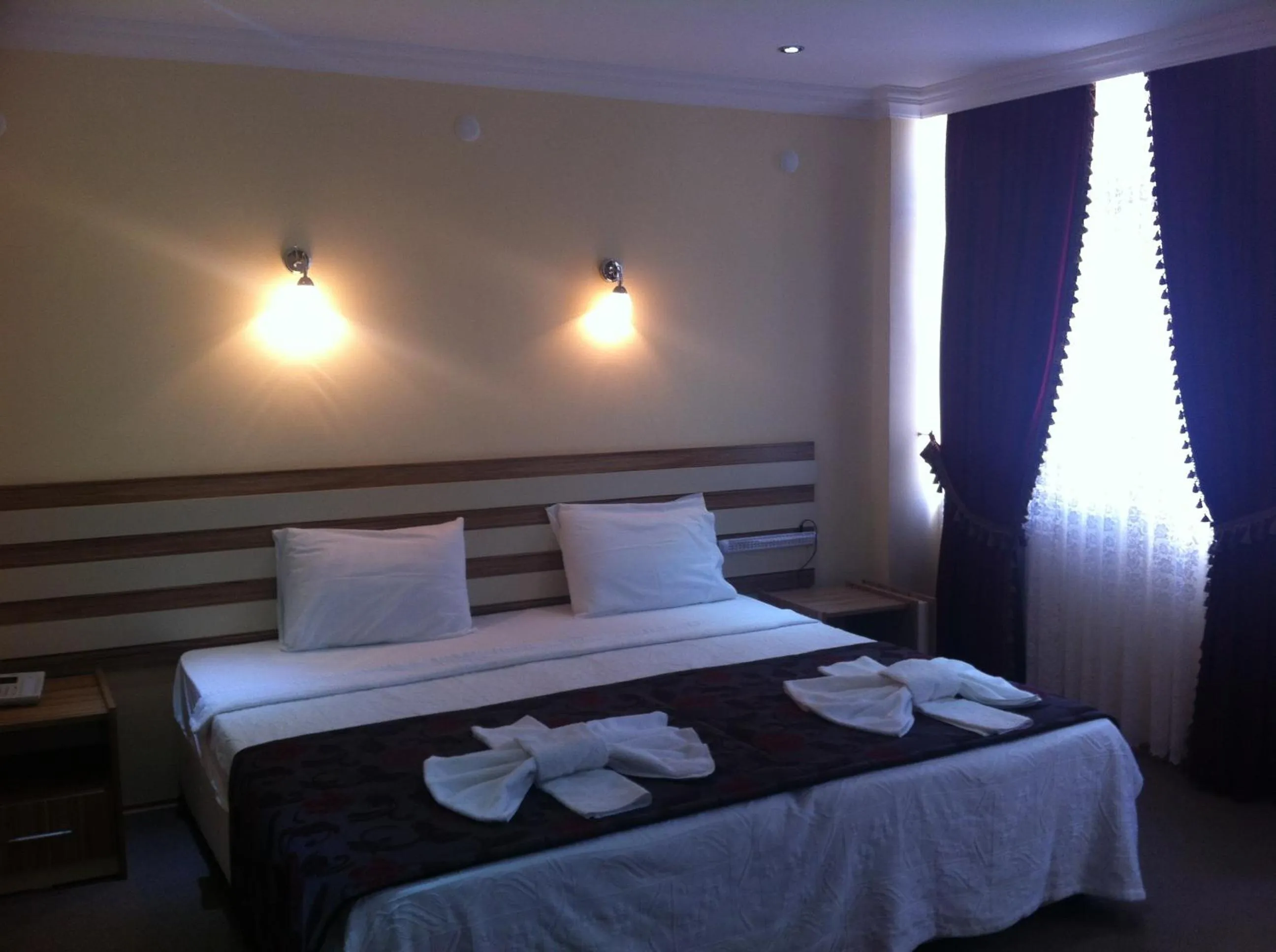 Photo of the whole room, Bed in TJ's Hotel