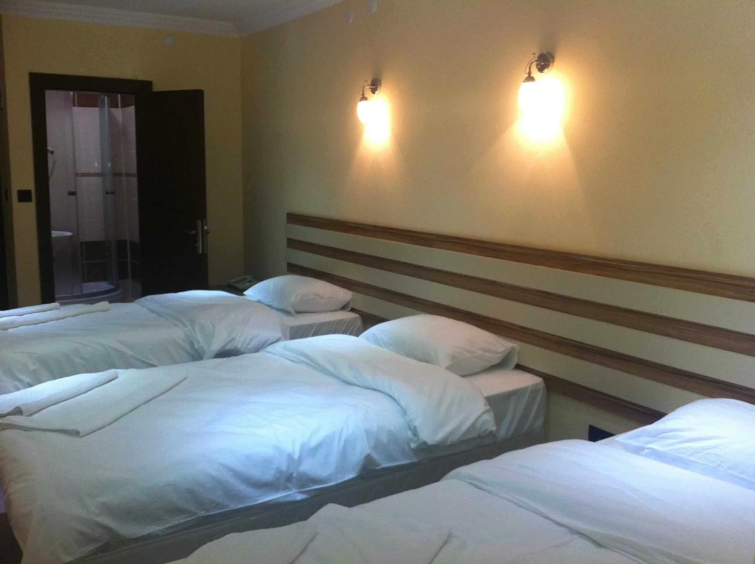 Photo of the whole room, Bed in TJ's Hotel