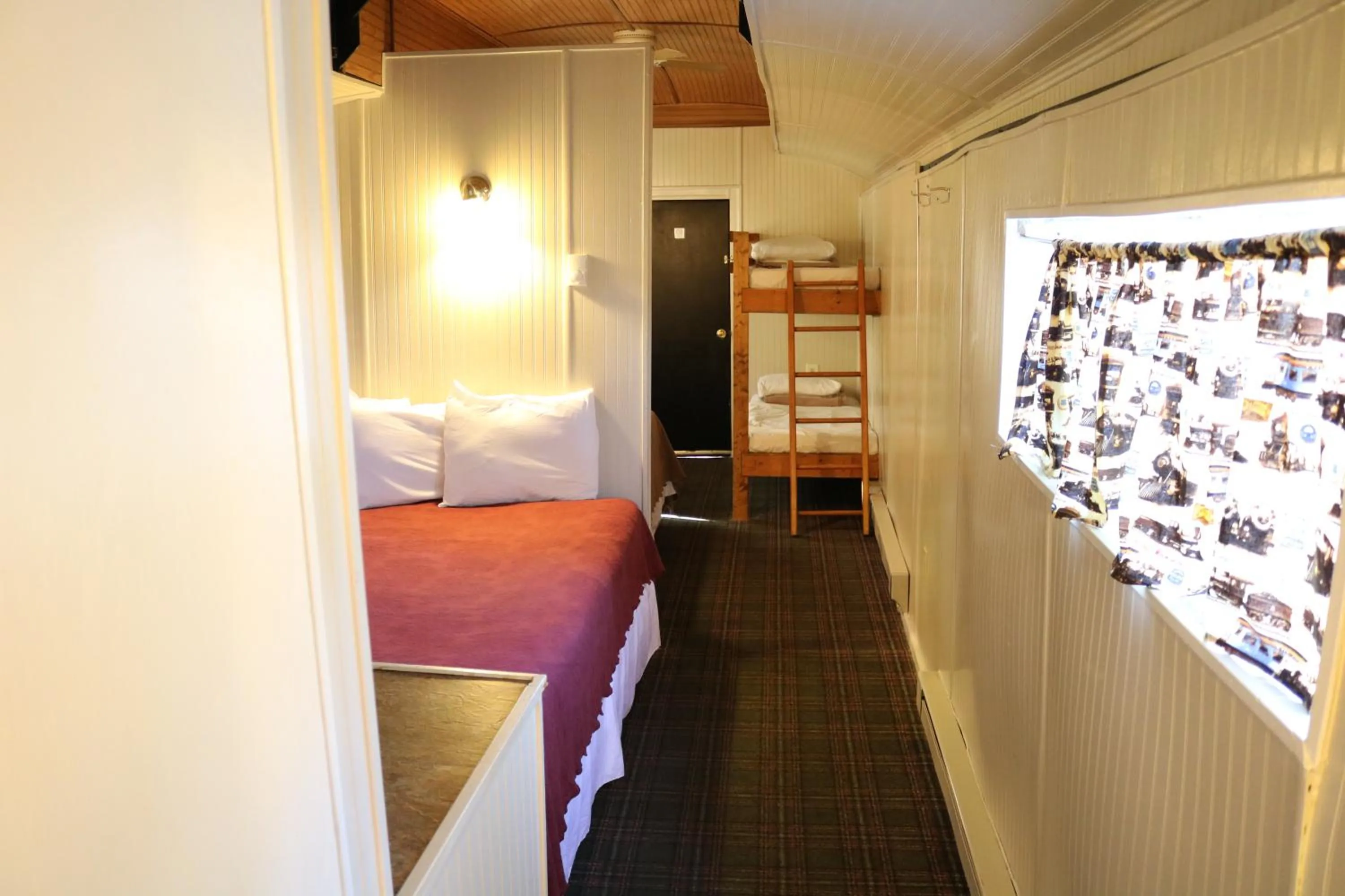 Bed in Red Caboose Motel & Restaurant