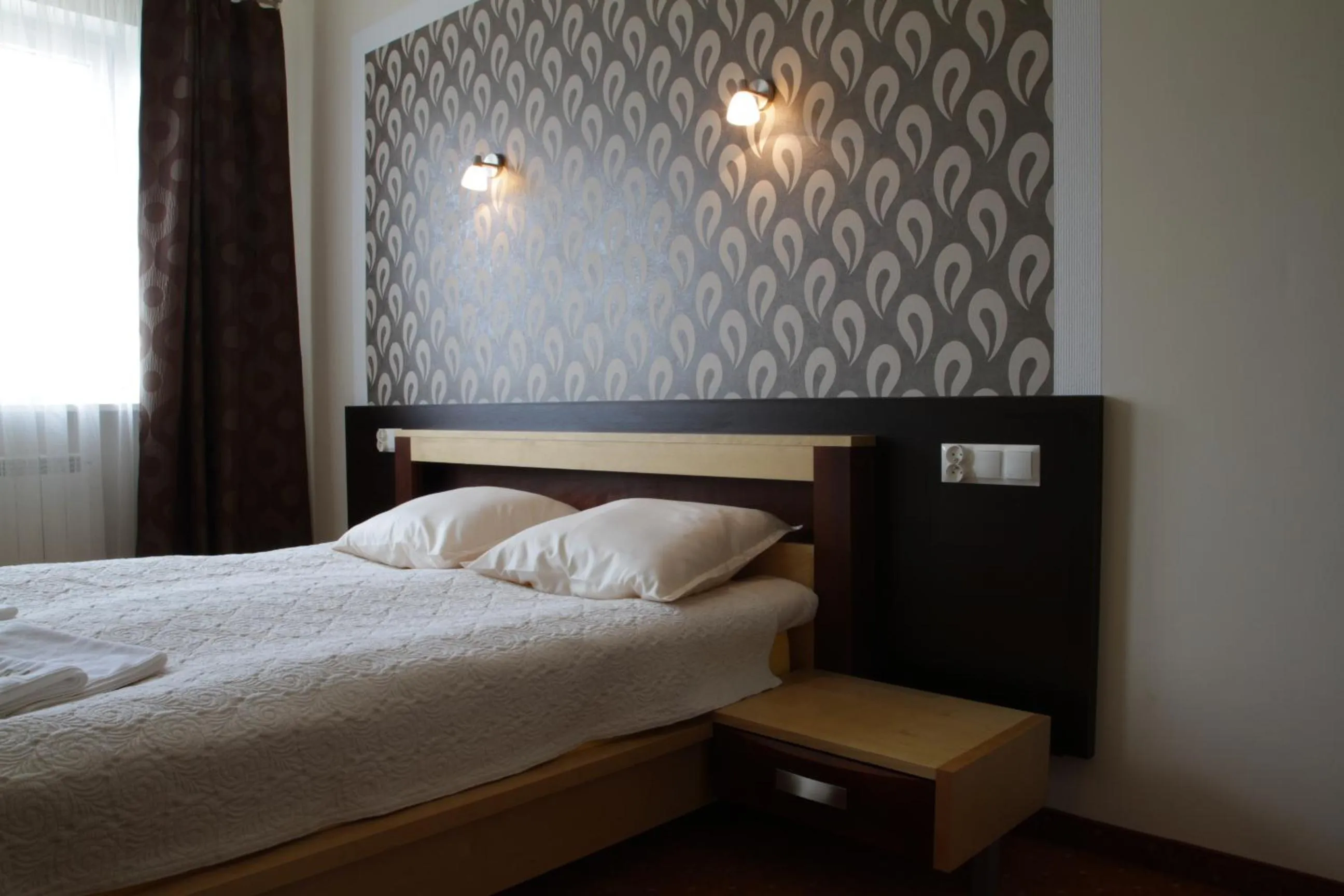 Bed in Hotel Trojka