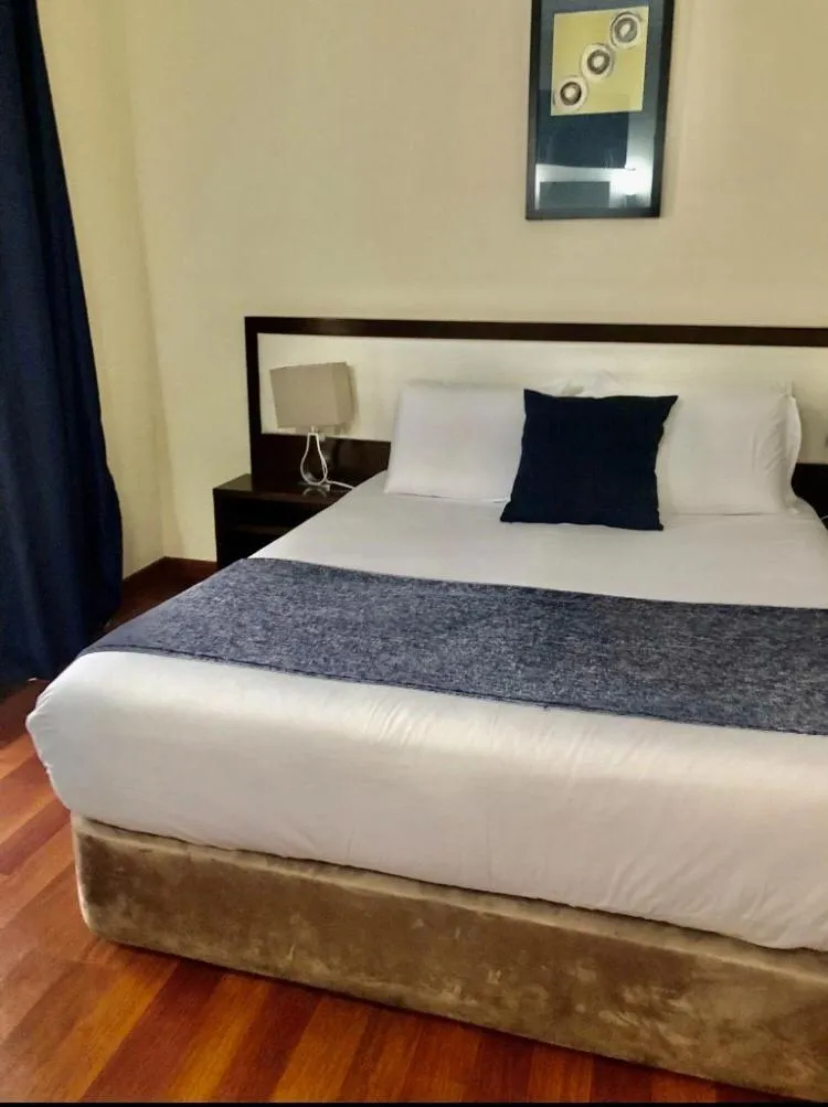 Bed in Hotel Excelsior