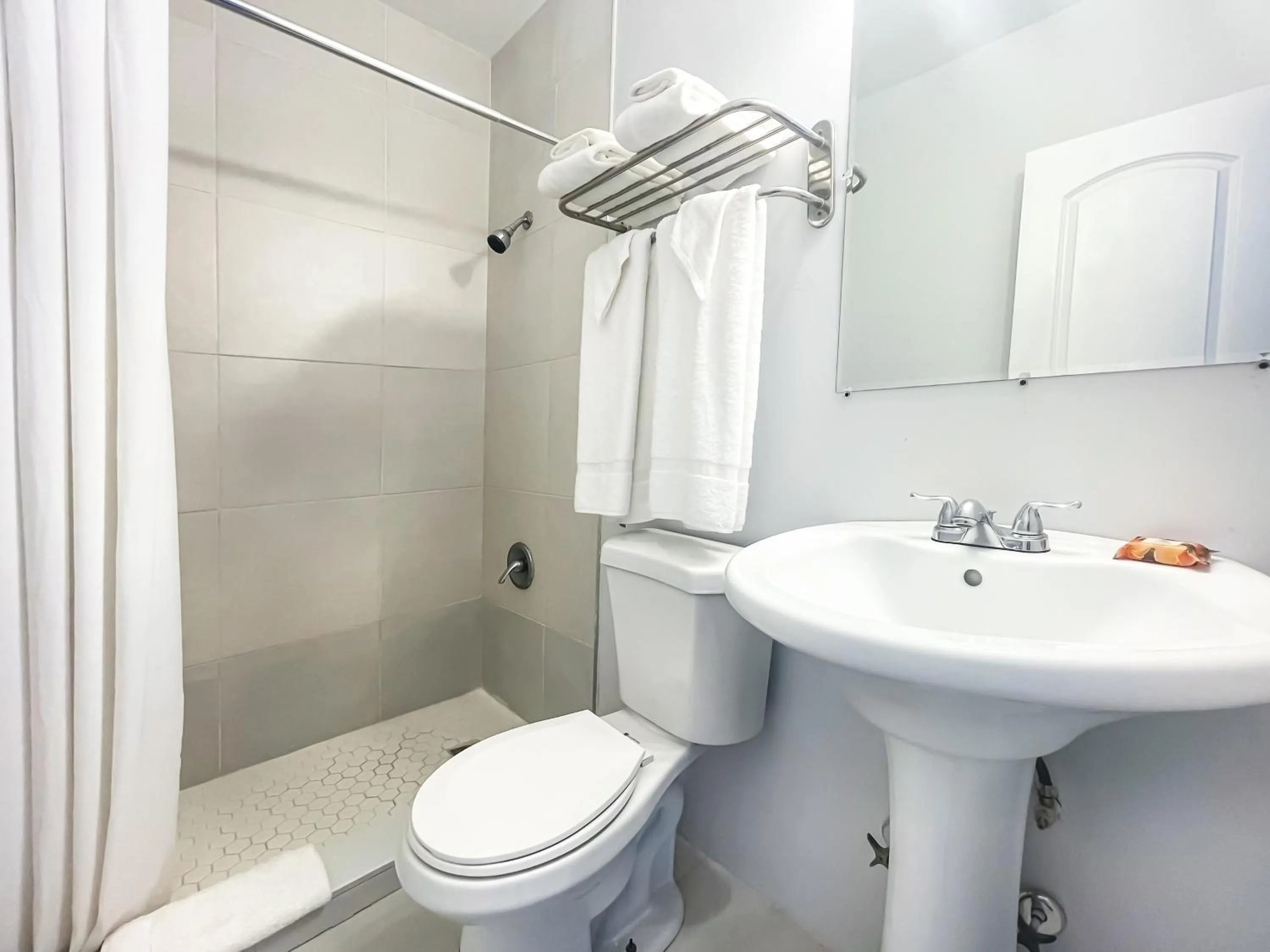 Bathroom in Paradise Oceanfront by HBH