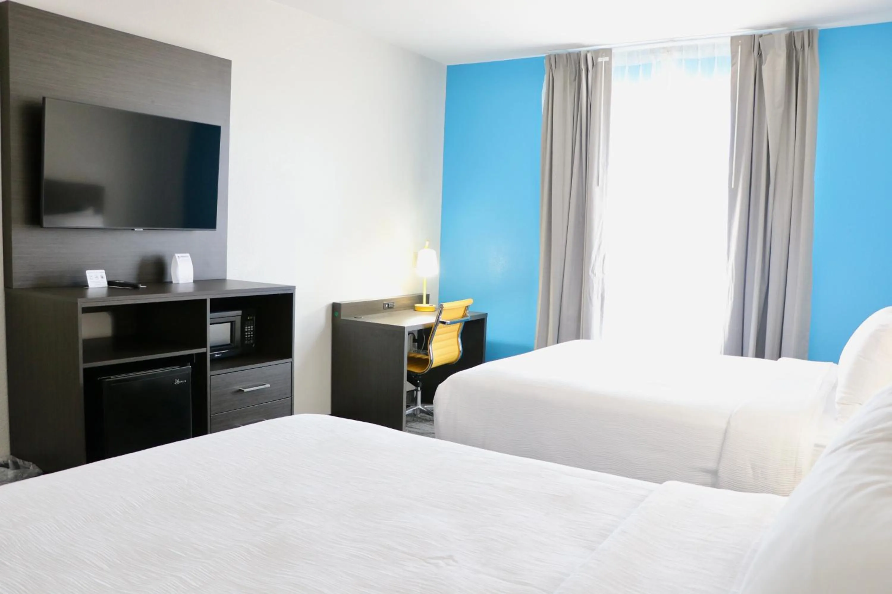 Bed in Quality Inn & Suites