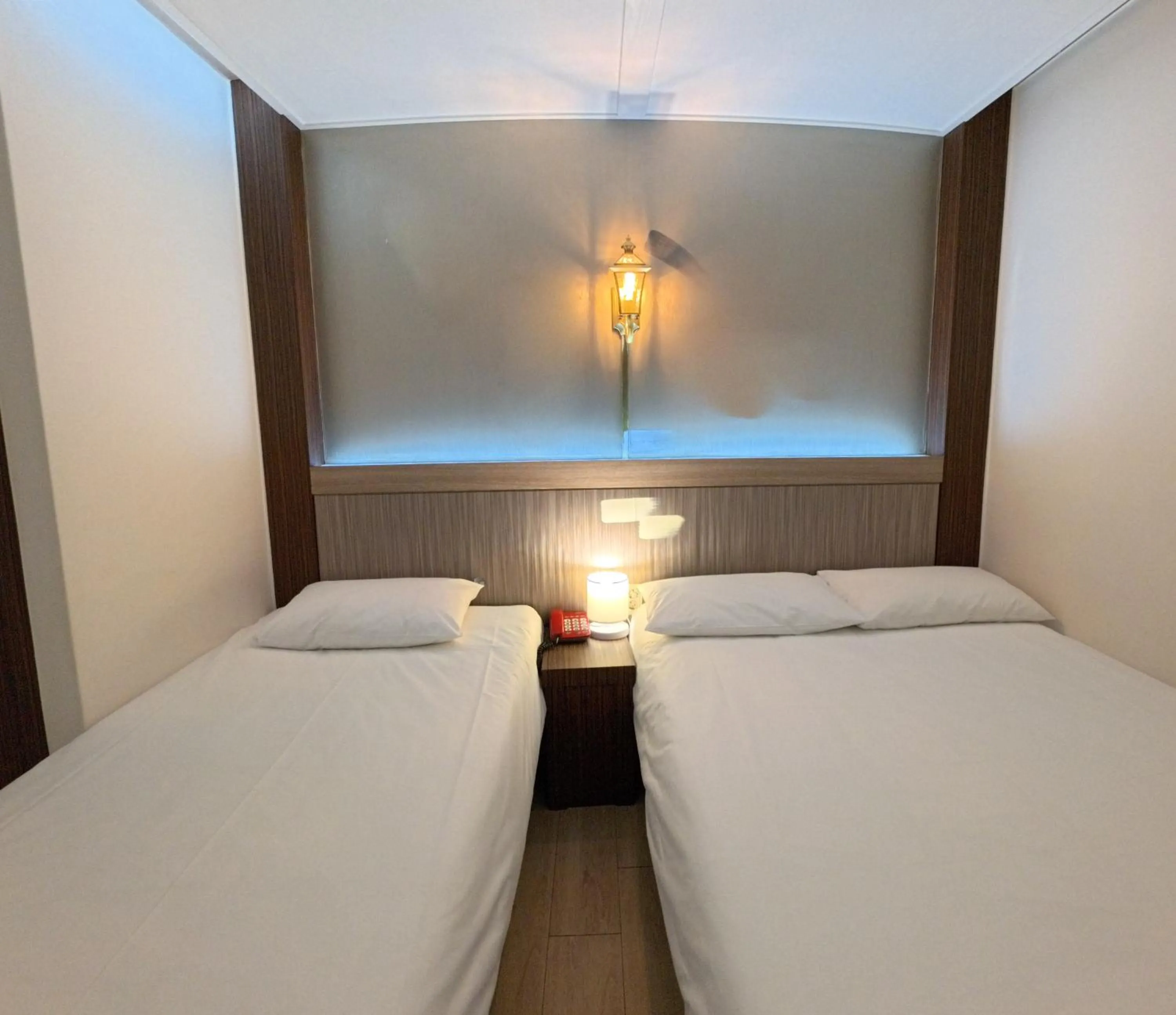 Bed in Friendly DH Naissance Hotel by Mindrum Group