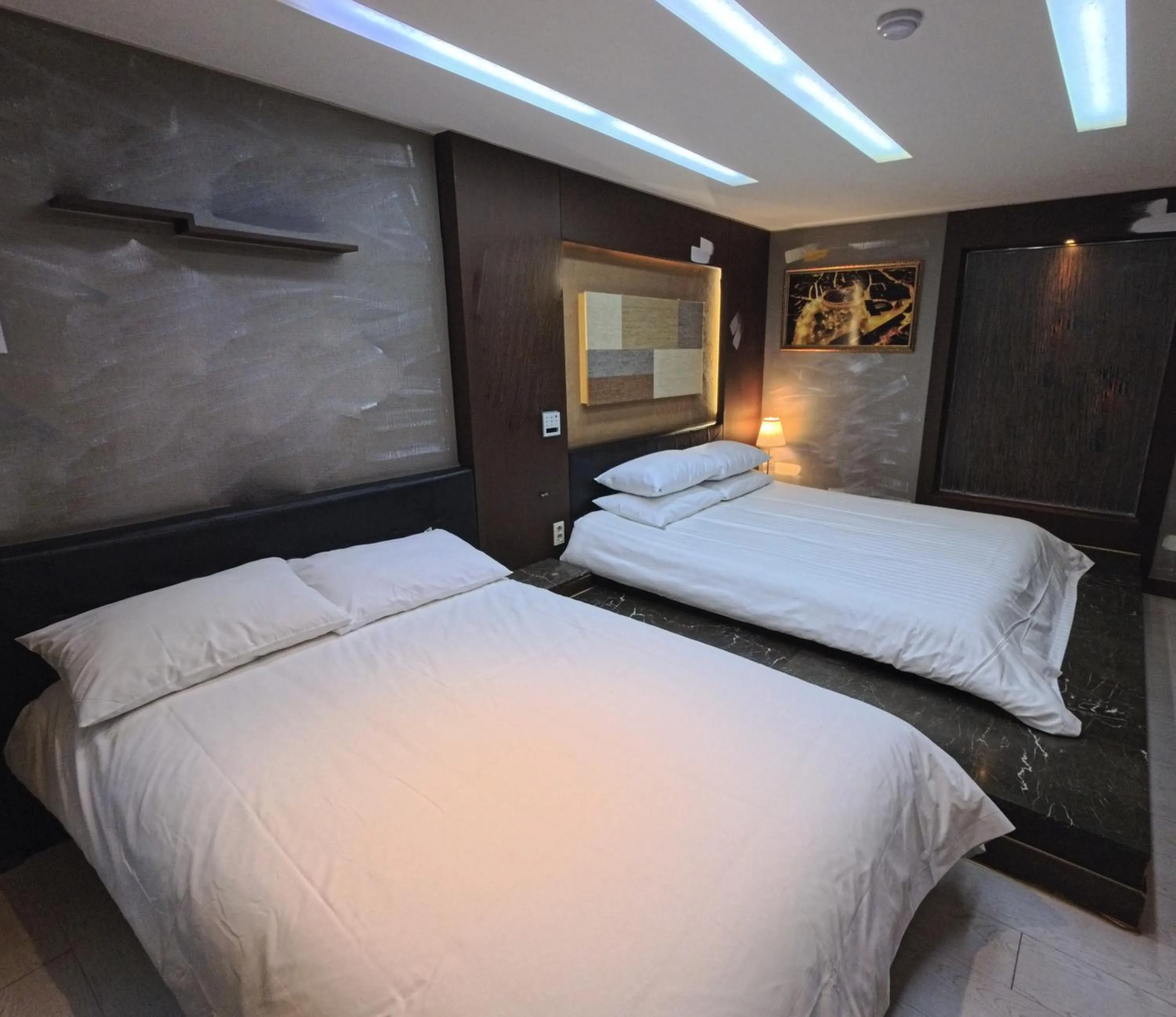 Bed in Friendly DH Naissance Hotel by Mindrum Group