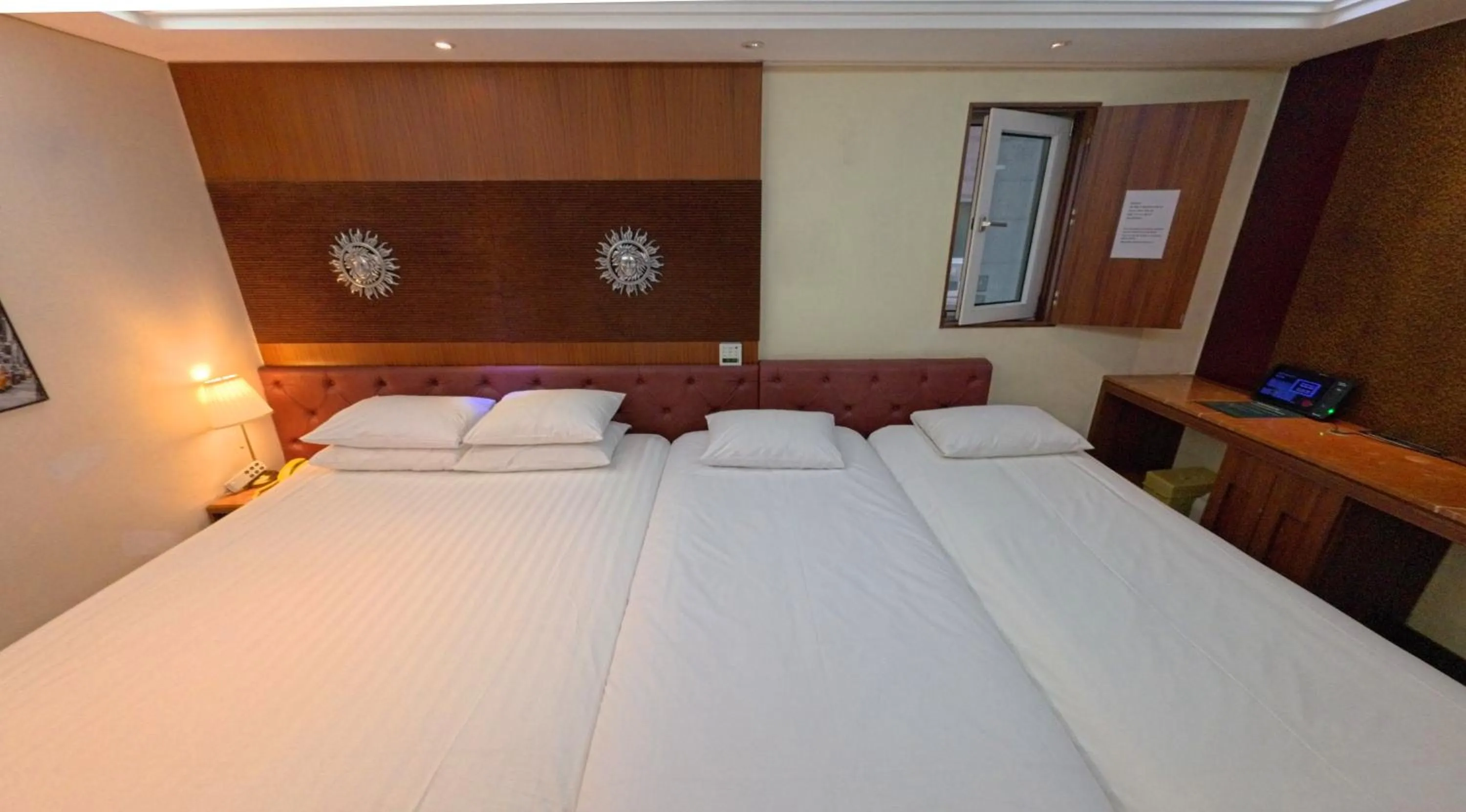 Bed in Friendly DH Naissance Hotel by Mindrum Group