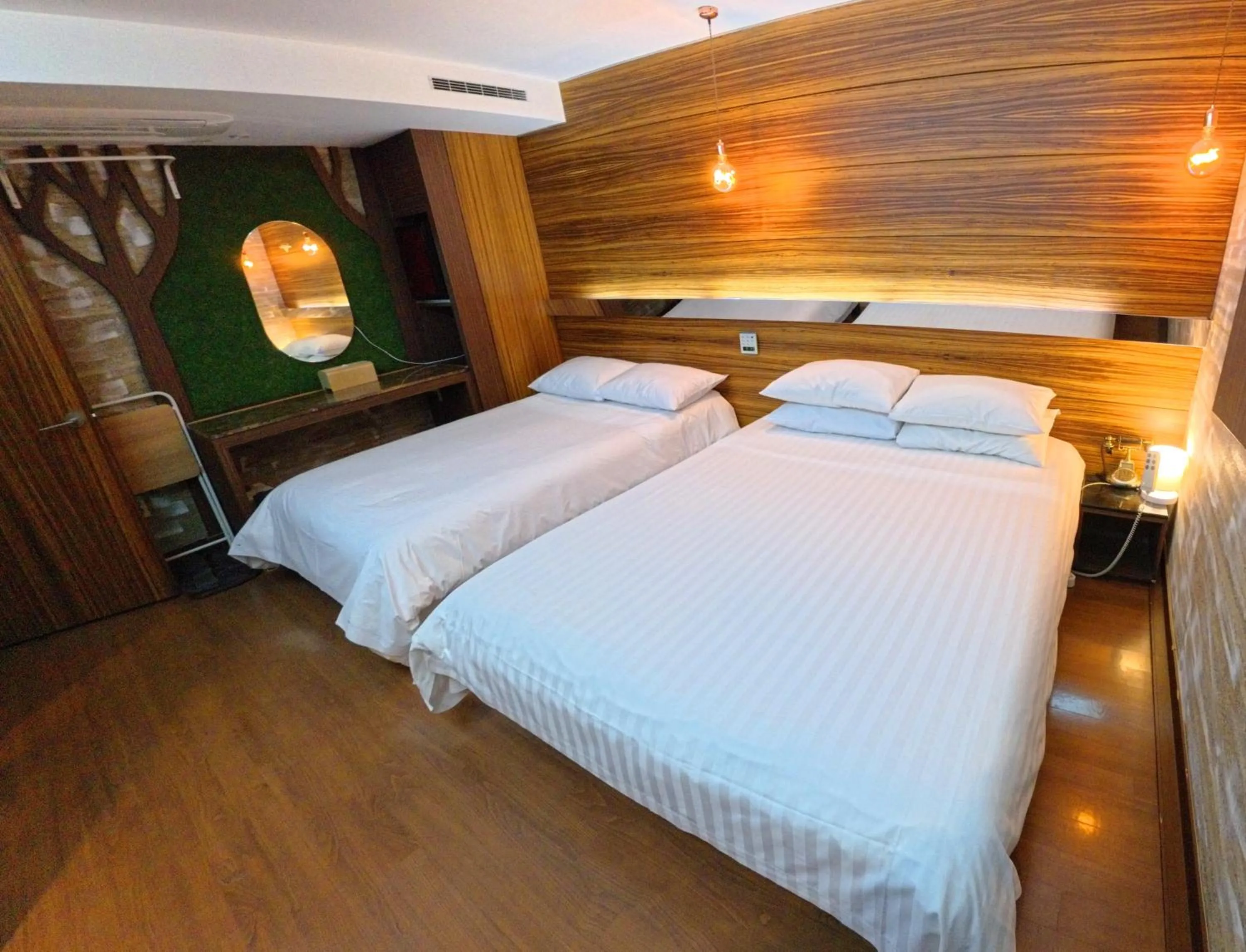 Bed in Friendly DH Naissance Hotel by Mindrum Group
