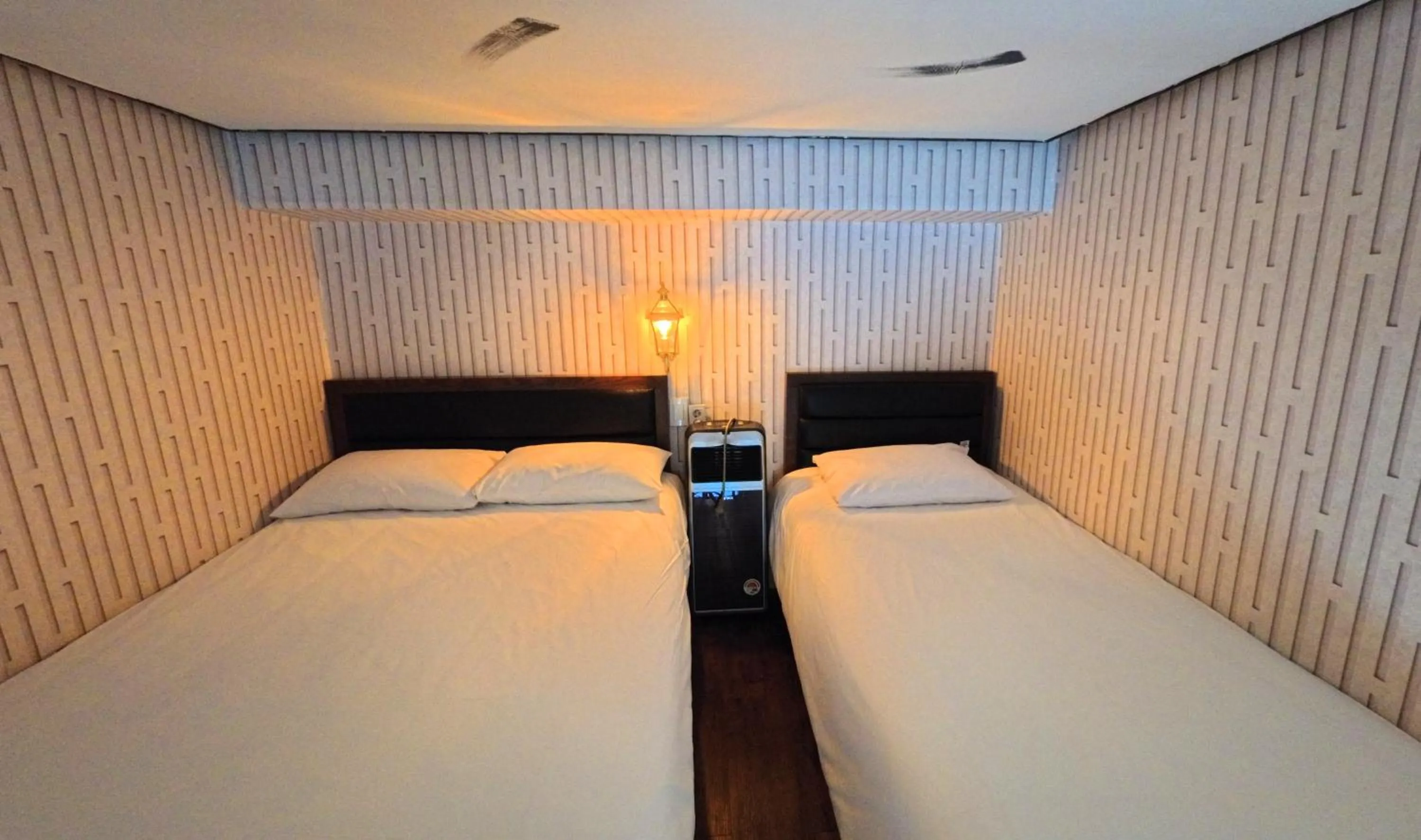 Bed in Friendly DH Naissance Hotel by Mindrum Group