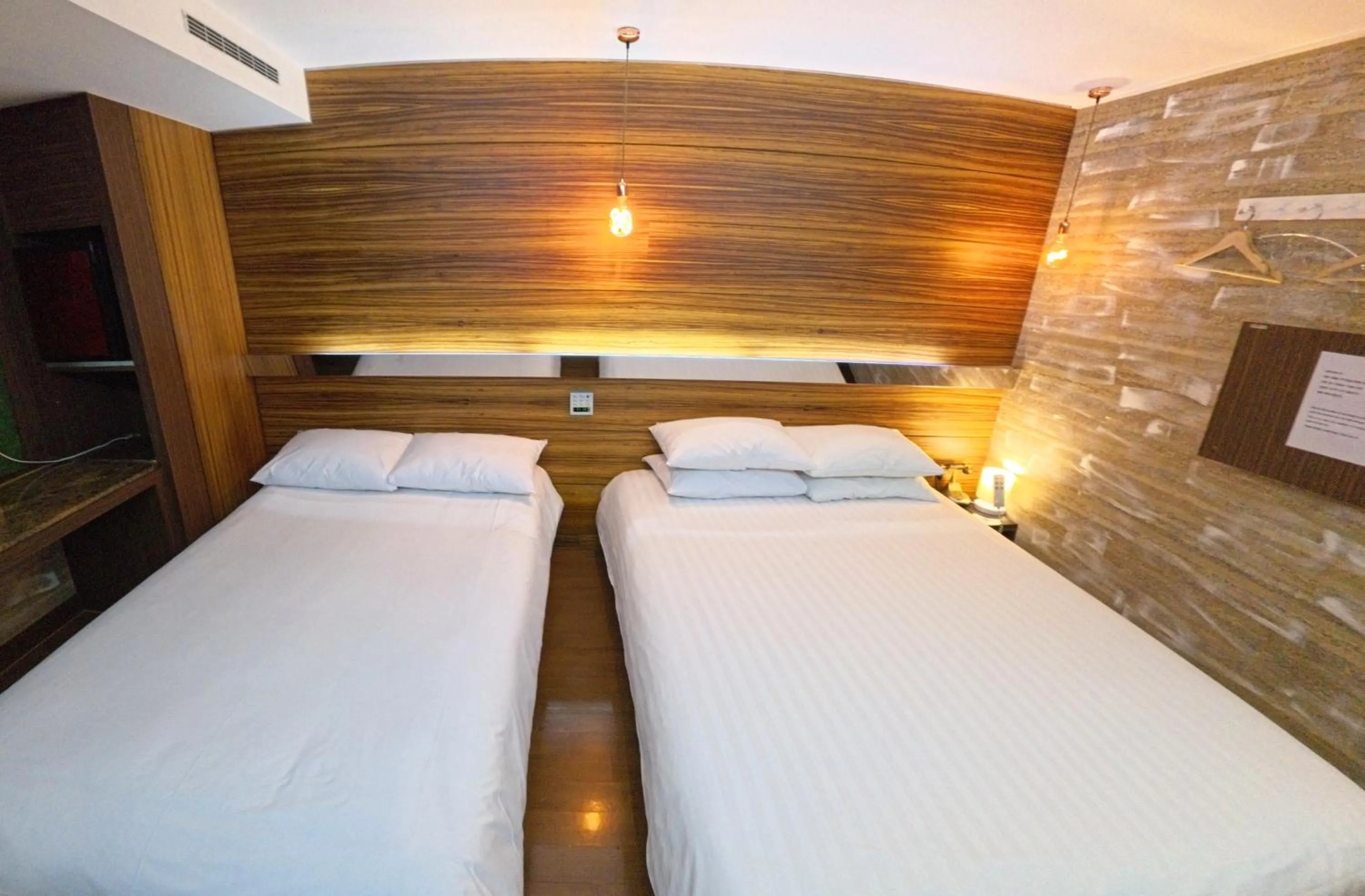 Bed in Friendly DH Naissance Hotel by Mindrum Group