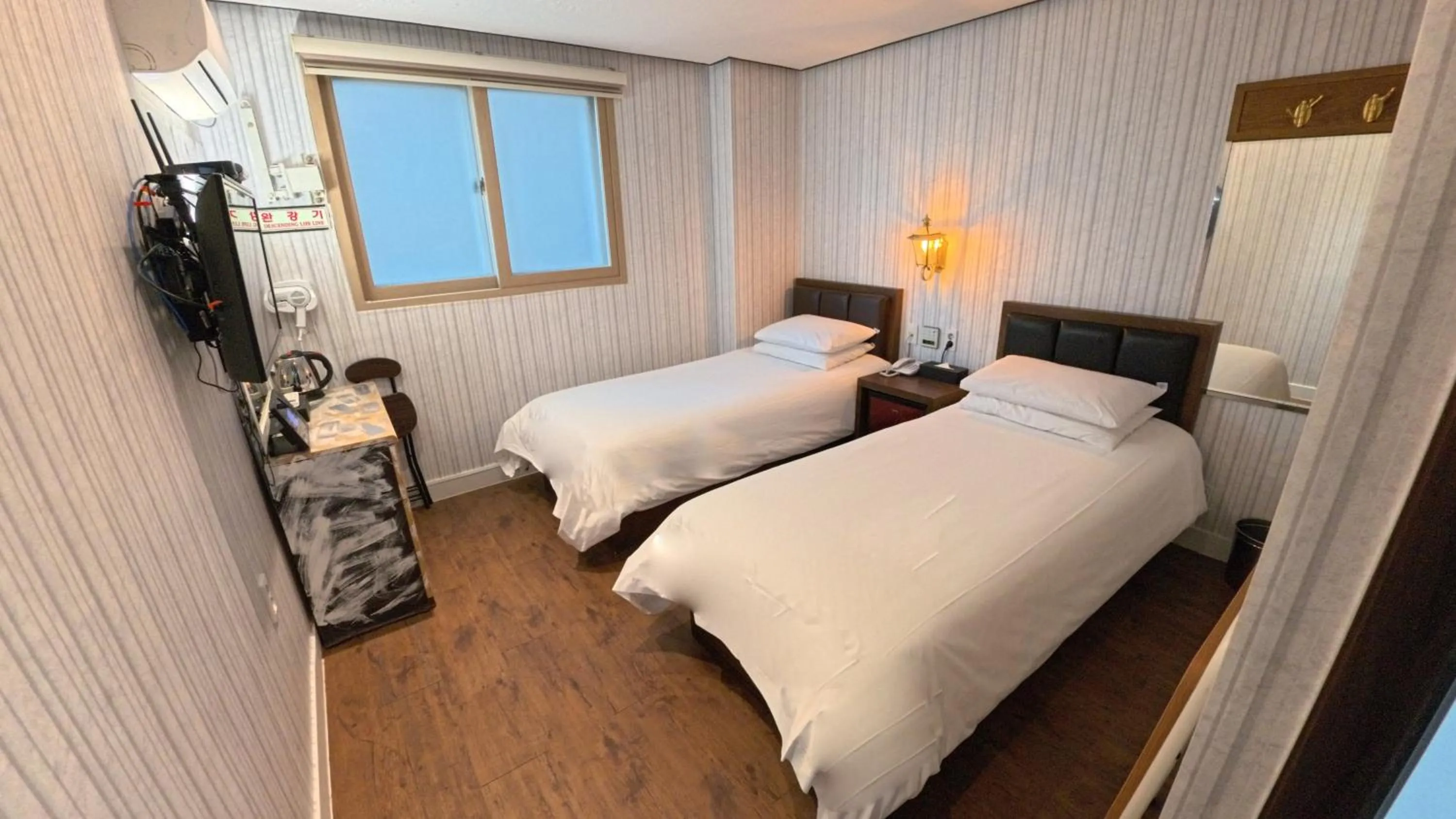 Bed in Friendly DH Naissance Hotel by Mindrum Group