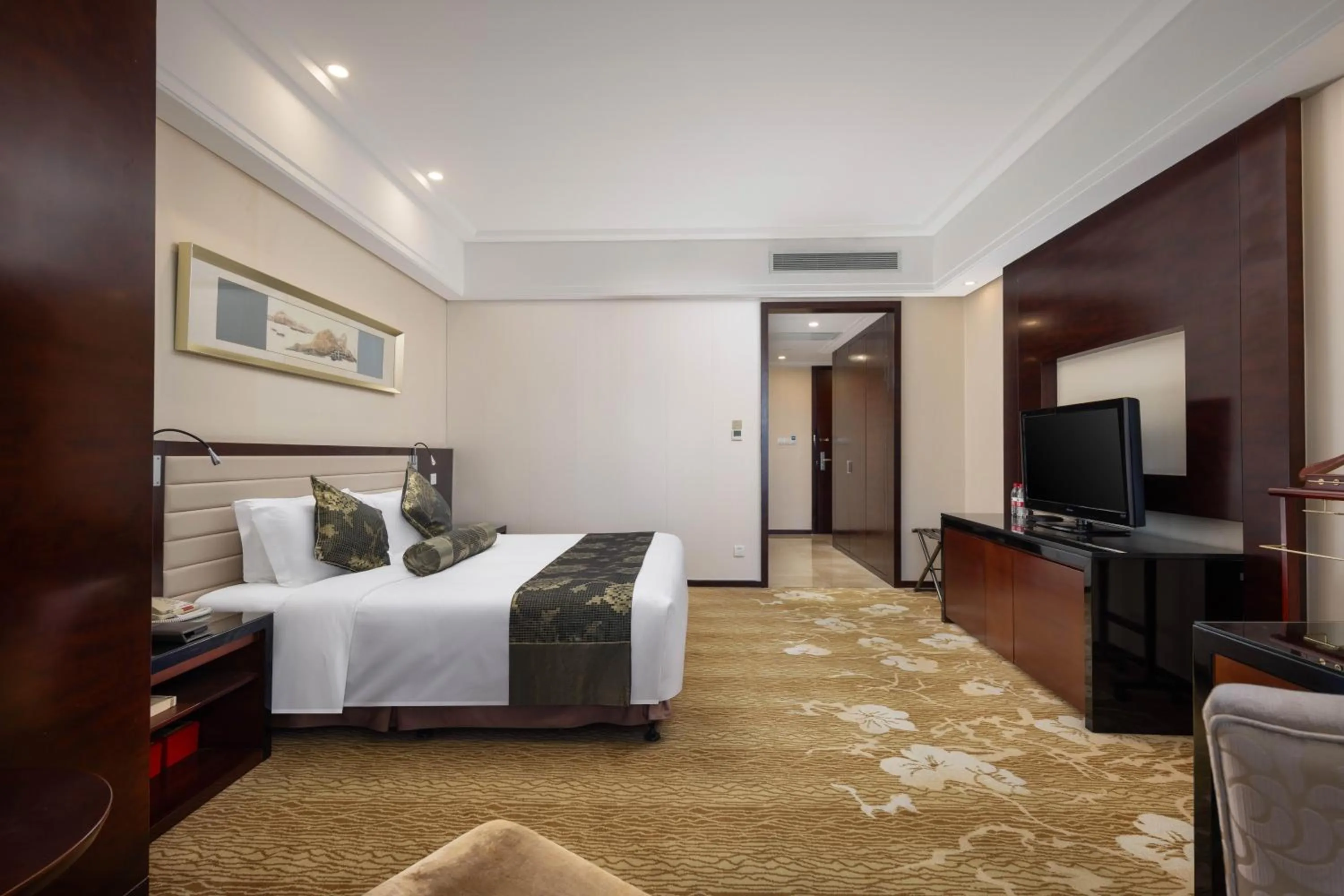 Bed in New Century Hotel Qingdao