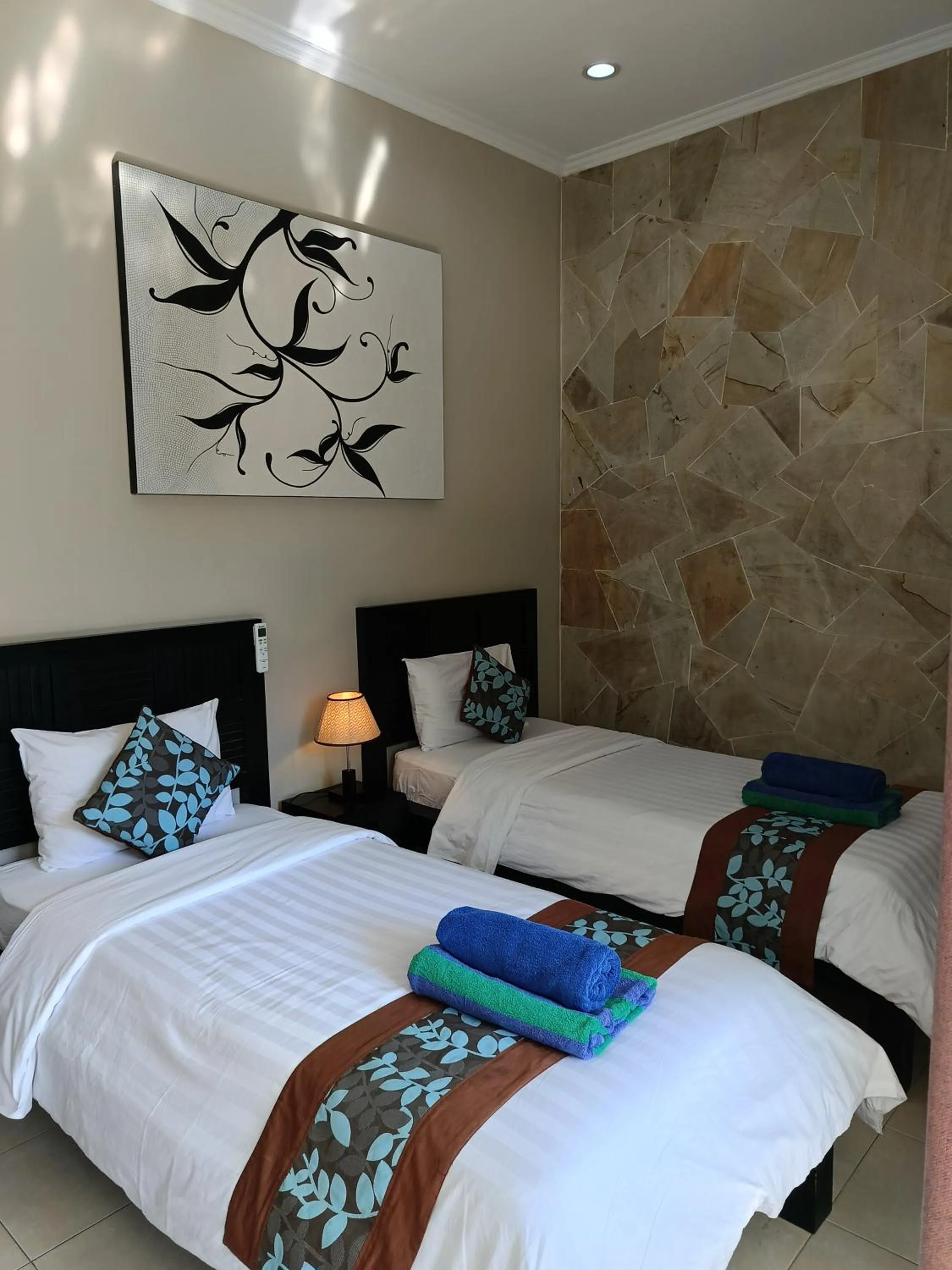 Bed in Gili Palms Resort