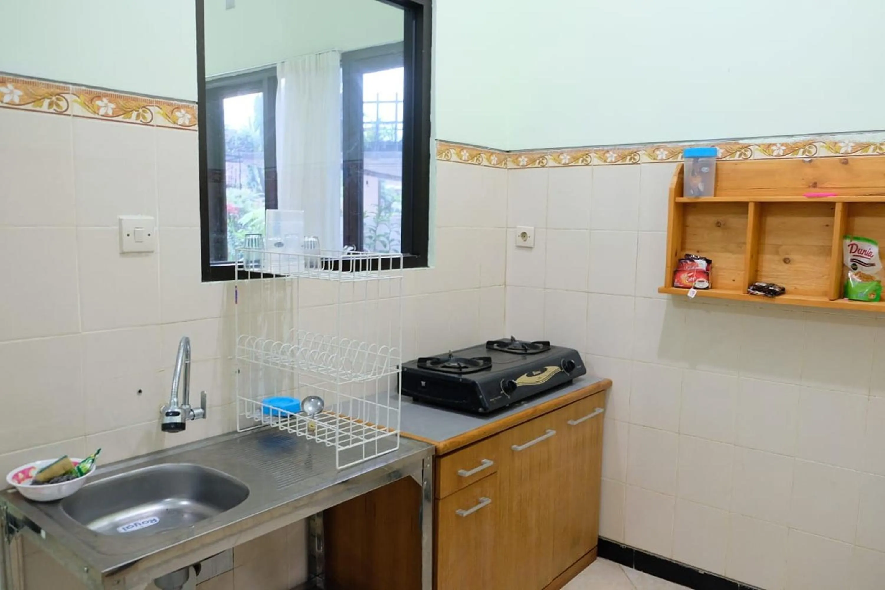Kitchen or kitchenette in Sekar Gambir Homestay