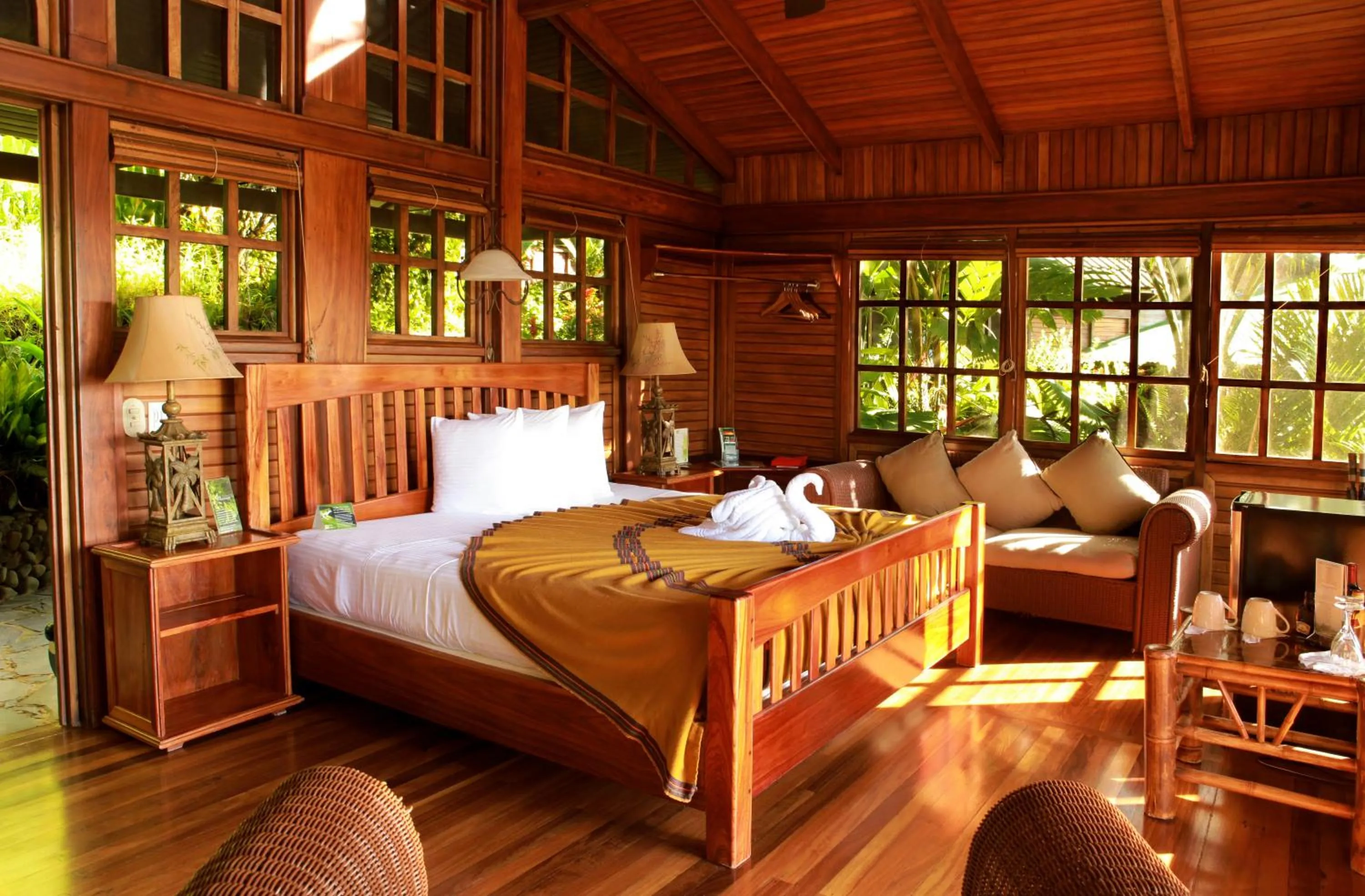 Bed in Aguila de Osa Rainforest Lodge