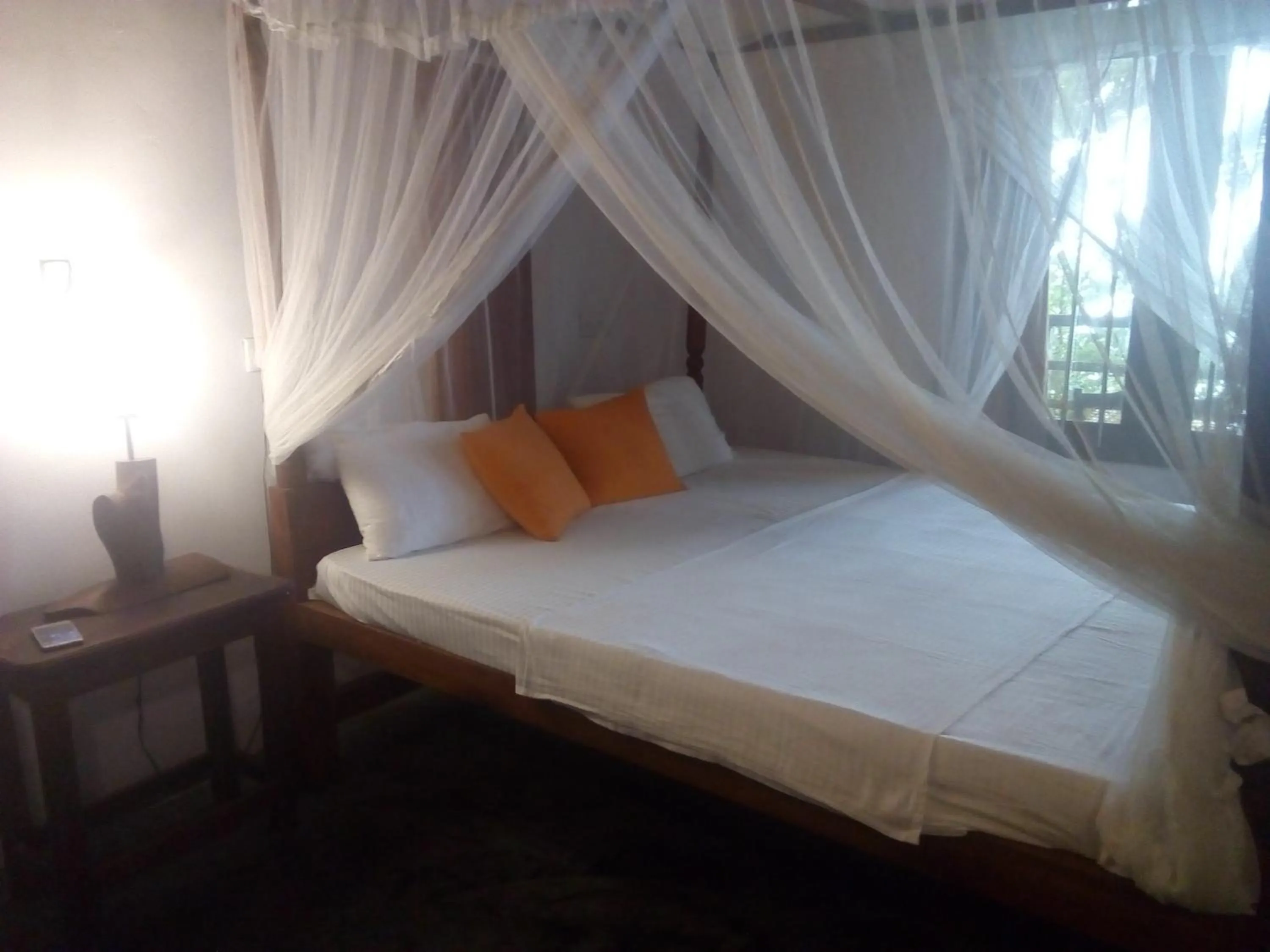 Bed in Sunset Colony Beach Resort