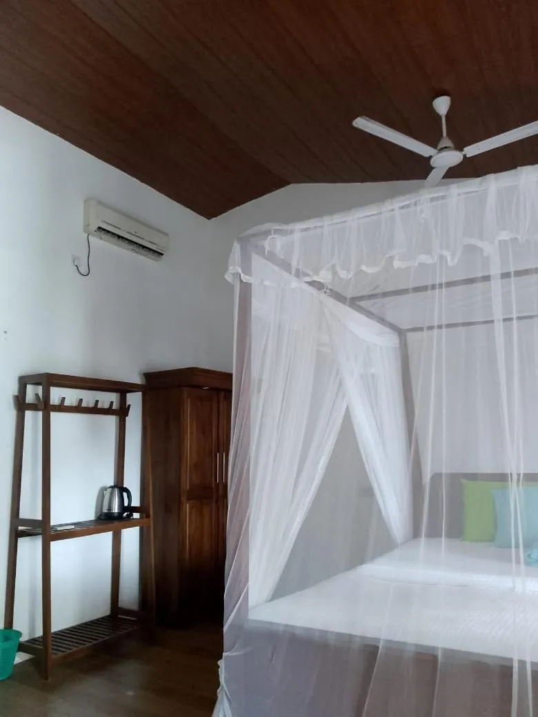 Bed in Sunset Colony Beach Resort