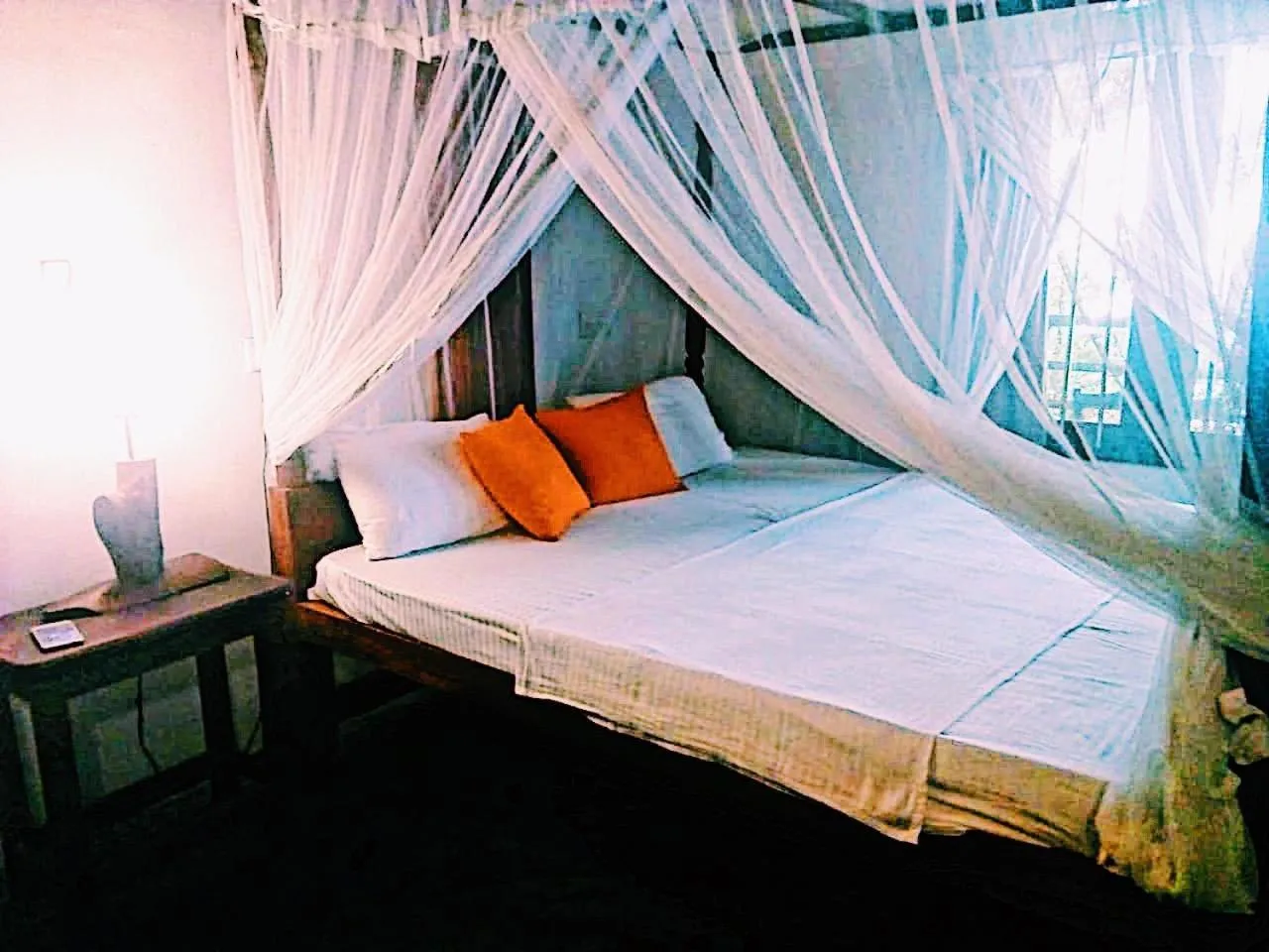 Bed in Sunset Colony Beach Resort