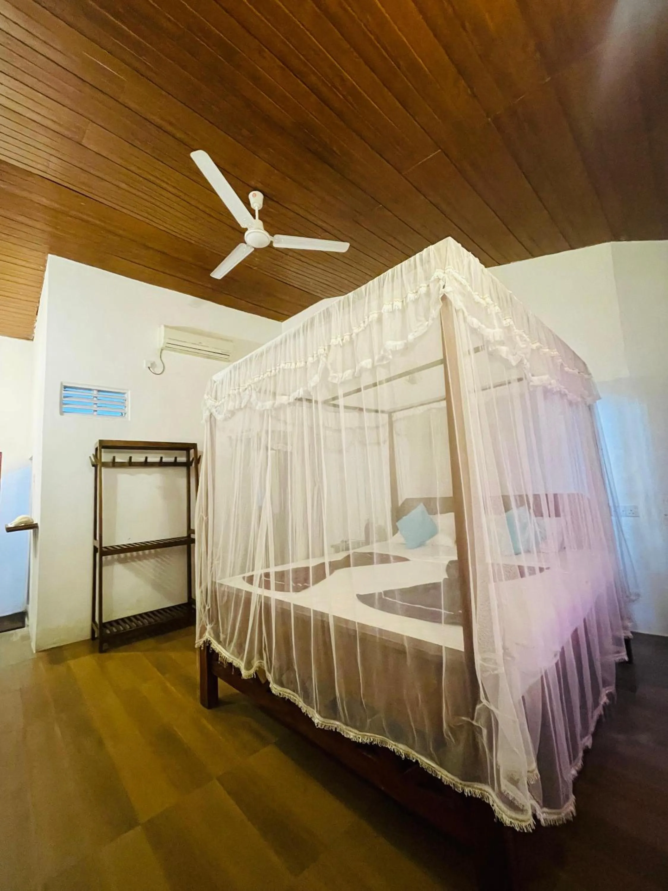 Bed in Sunset Colony Beach Resort
