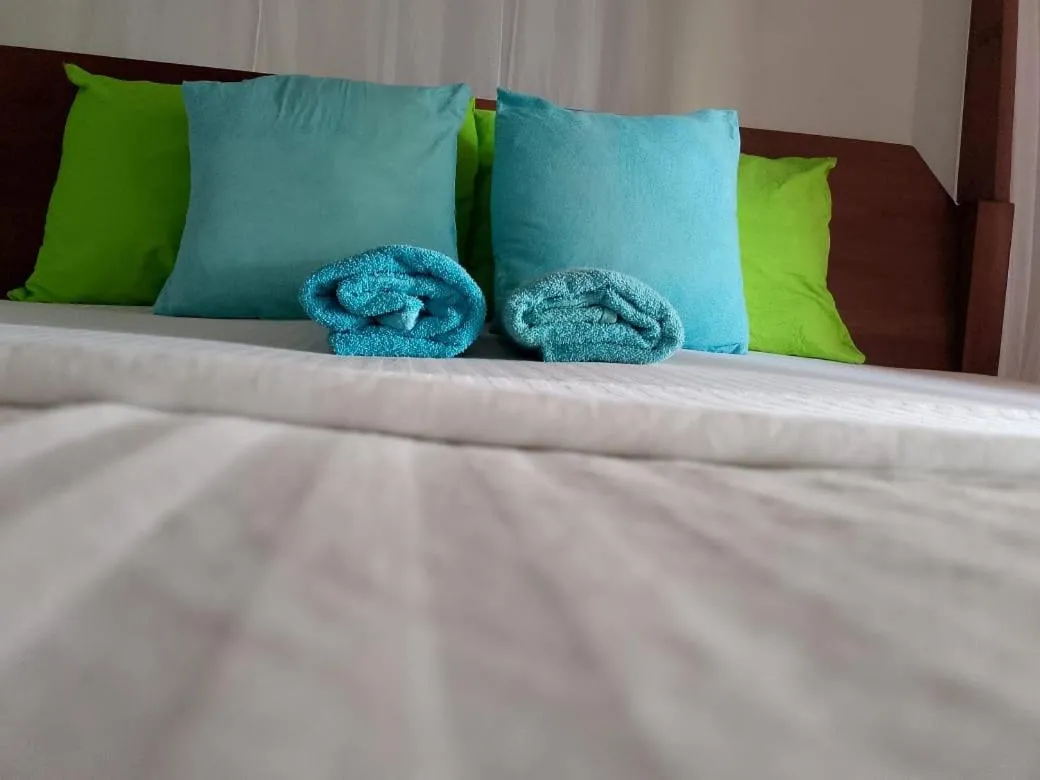 Bed in Sunset Colony Beach Resort