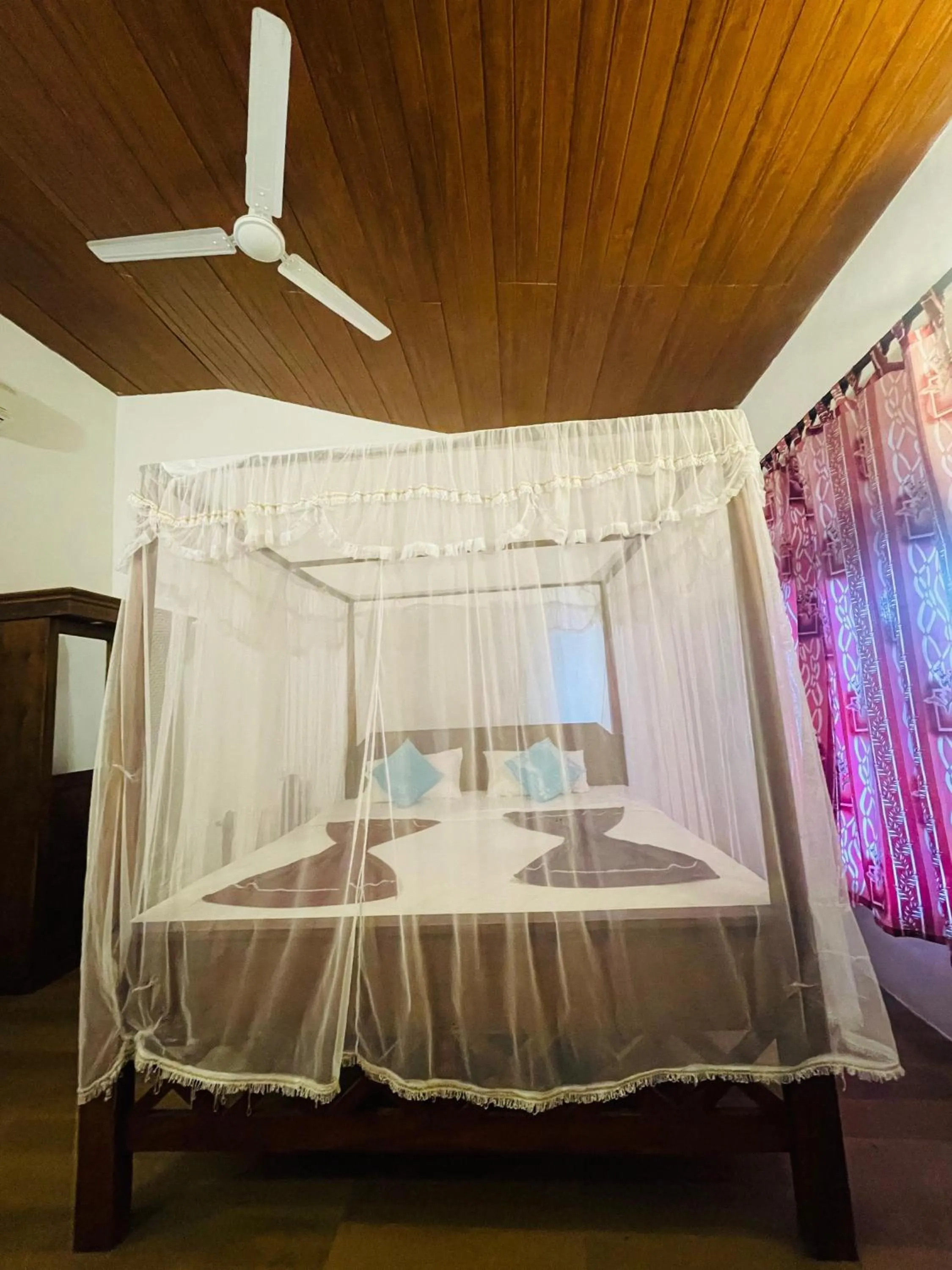 Bed in Sunset Colony Beach Resort
