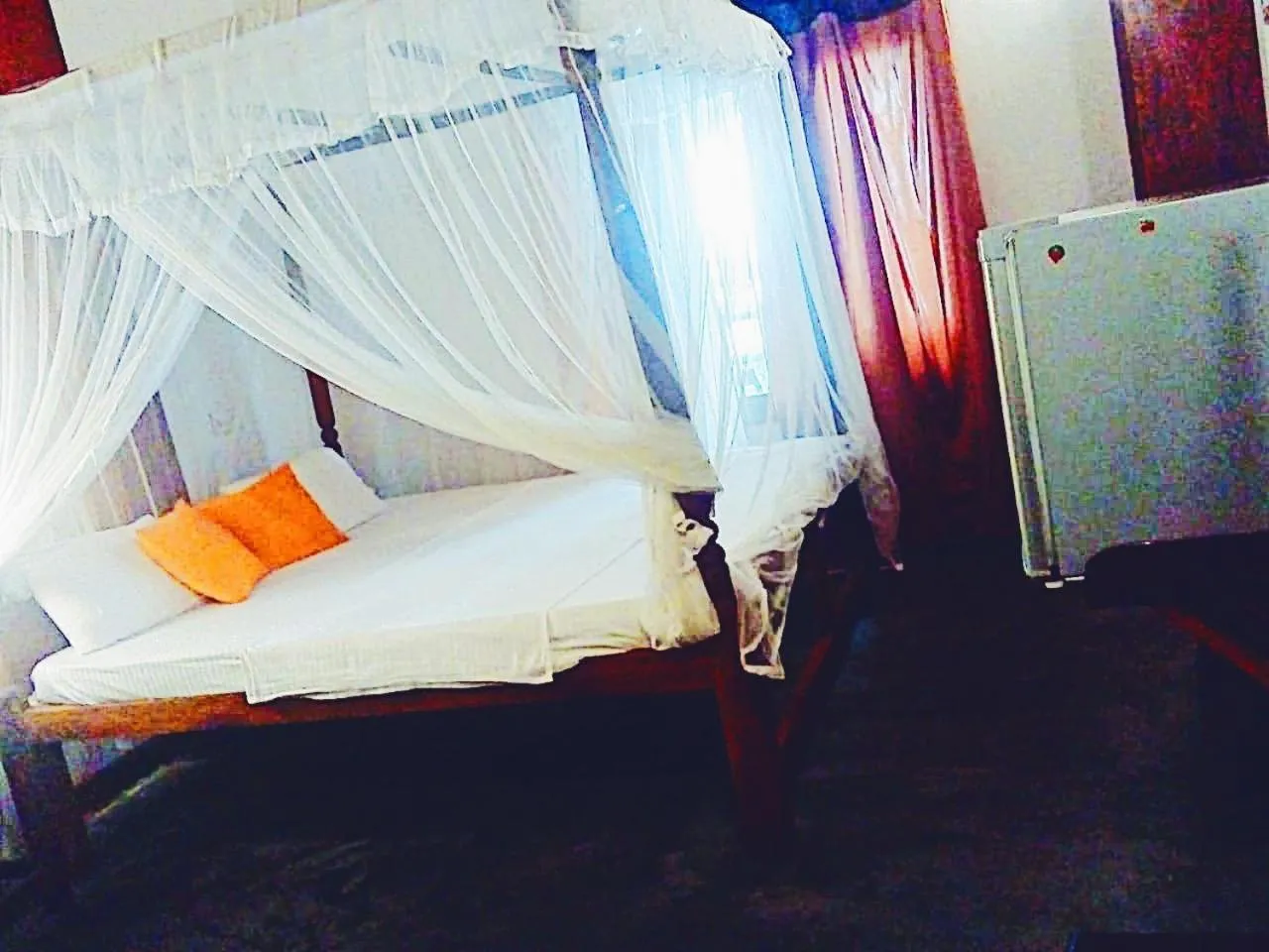 Bed in Sunset Colony Beach Resort