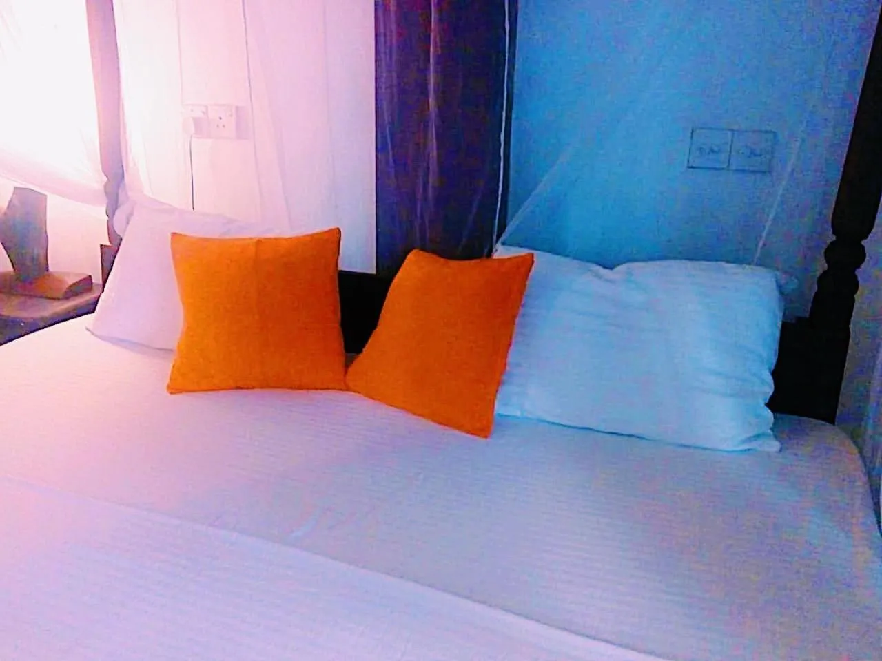 Bed in Sunset Colony Beach Resort