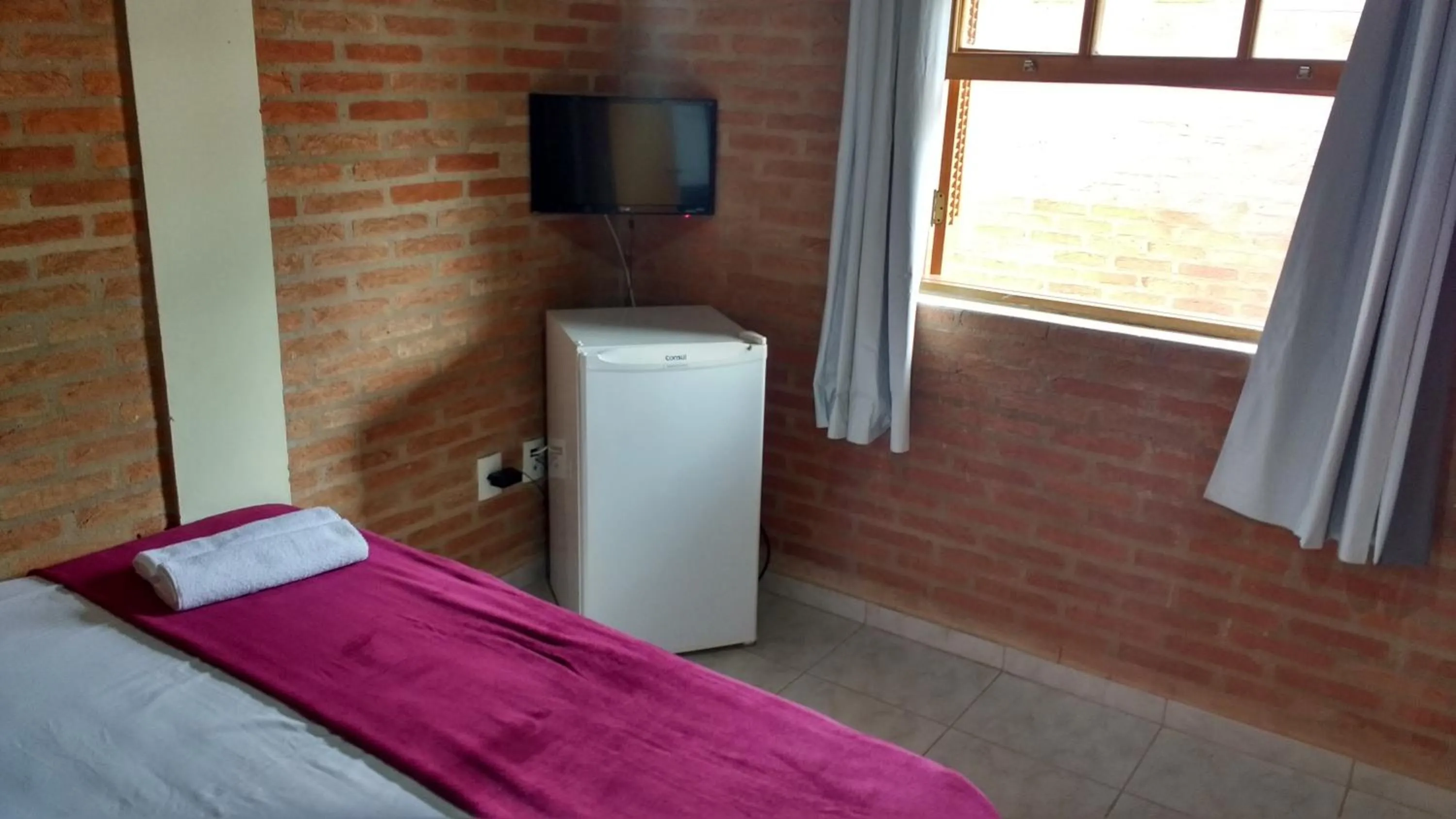 Photo of the whole room, Bed in Aconchego do Guara , próximo ao centro médico, Boldrini, Unicamp, Laboratório CNPEN, Universidades e Hospital Sobrapar
