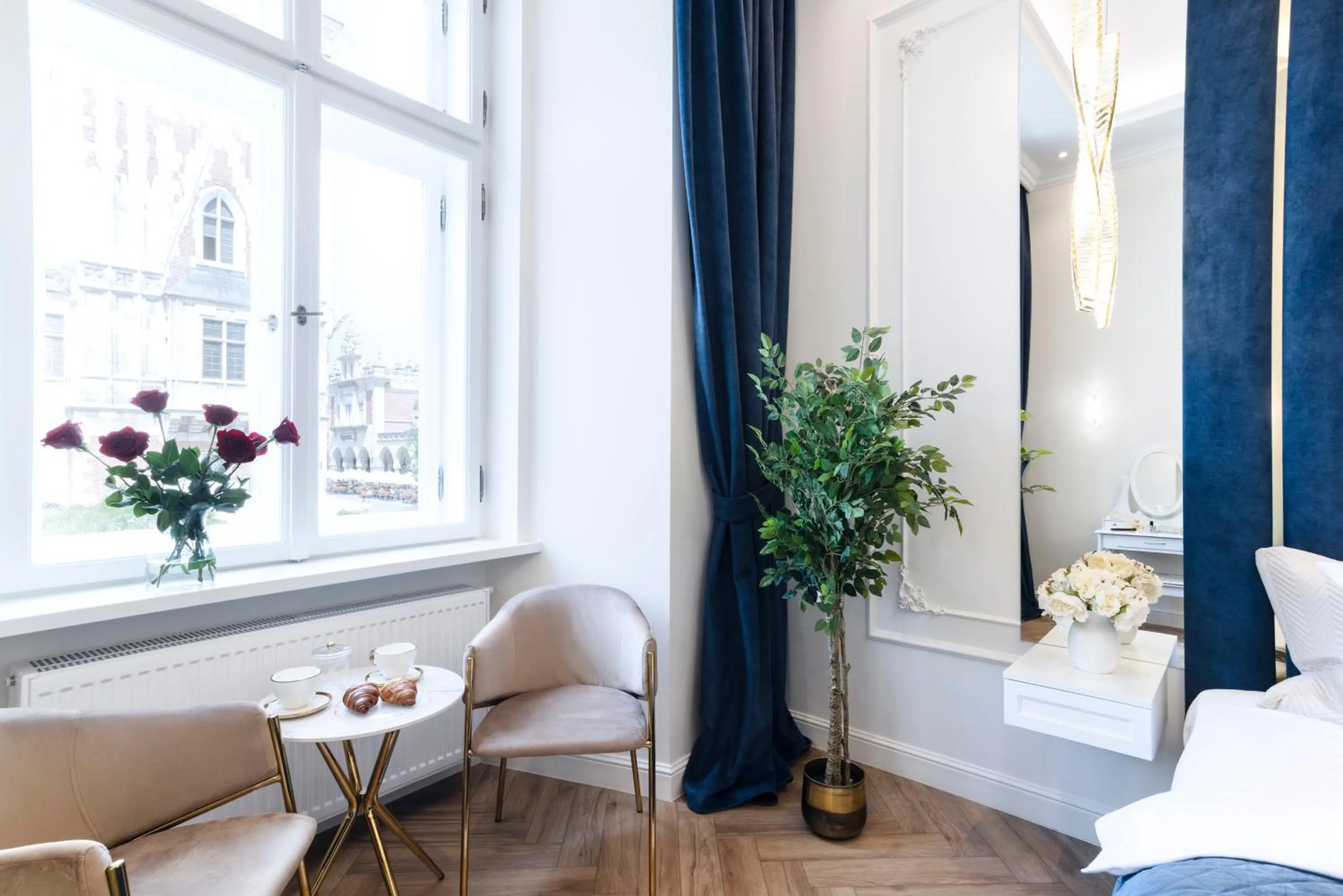 Seating area, Bed in Main Square Apartments