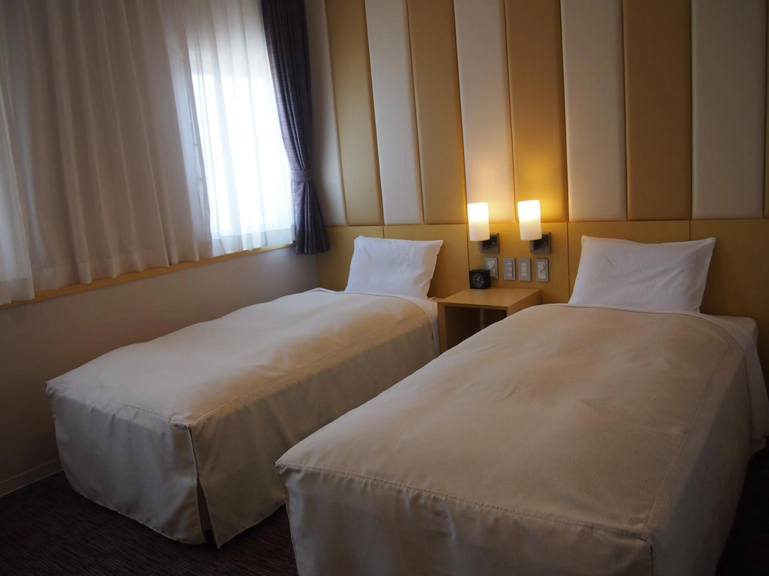 Bed in Hotel Sunroute Kumamoto